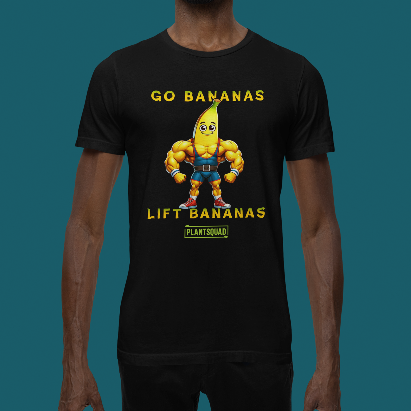 A Plantsquad Banana "Go Bananas Lift Bananas" - Unisex T-Shirt features a cartoon muscular banana wearing gym shorts, and boots. Above the banana, it says "GO BANANAS" and below it says "LIFT BANANAS". There is also a small green "plantsquad" logo at the bottom.