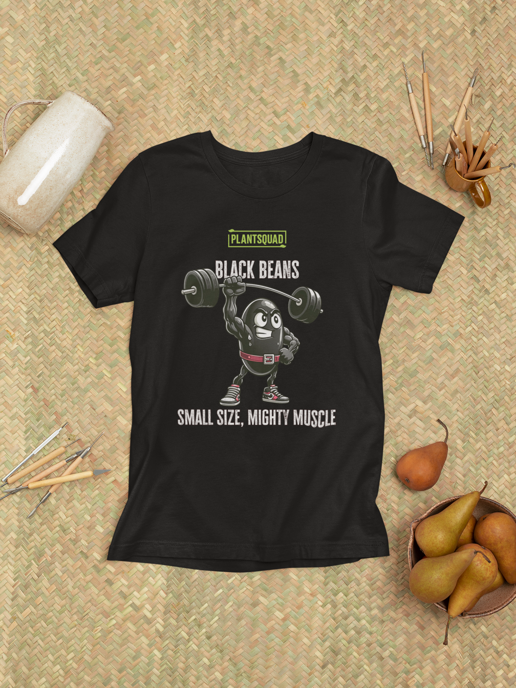 A Plantsquad Black Bean "Black Beans Small Size Mighty Muscle" - Unisex T-Shirt features a cartoon black bean character lifting a barbell with one hand. The top proudly reads "PLANTSQUAD," followed by "BLACK BEANS," while the bottom showcases the inspiring slogan "SMALL SIZE, MIGHTY MUSCLE.
