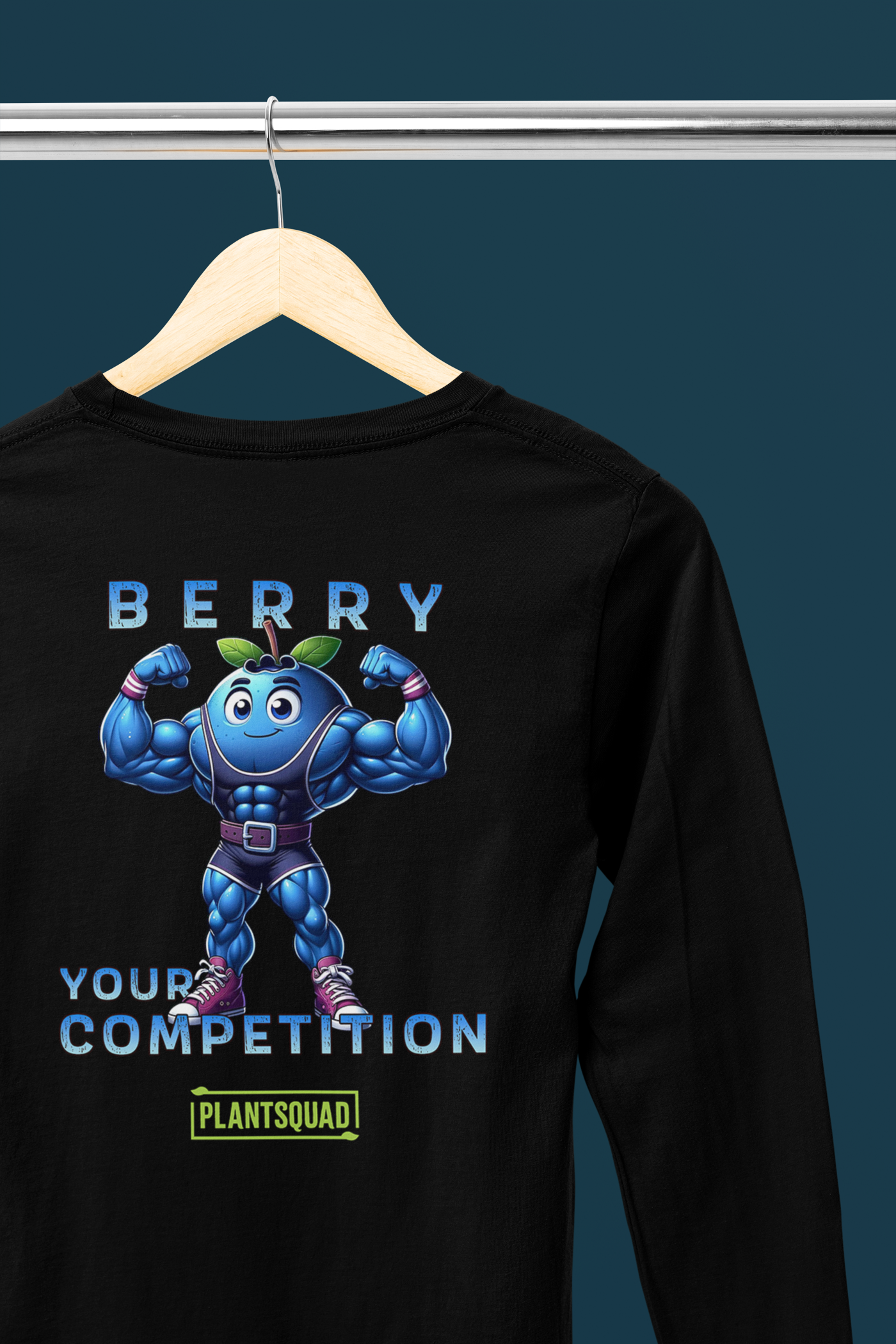 A Plantsquad Blueberry "Berry Your Competition" - Unisex Long Sleeve T-Shirt featuring a muscly blueberry cartoon character flexing its arms, with the text "BERRY YOUR COMPETITION" above and below it, and "PLANTSQUAD" written in a green box beneath the character. Ideal for fitness enthusiasts embracing the vegan lifestyle.