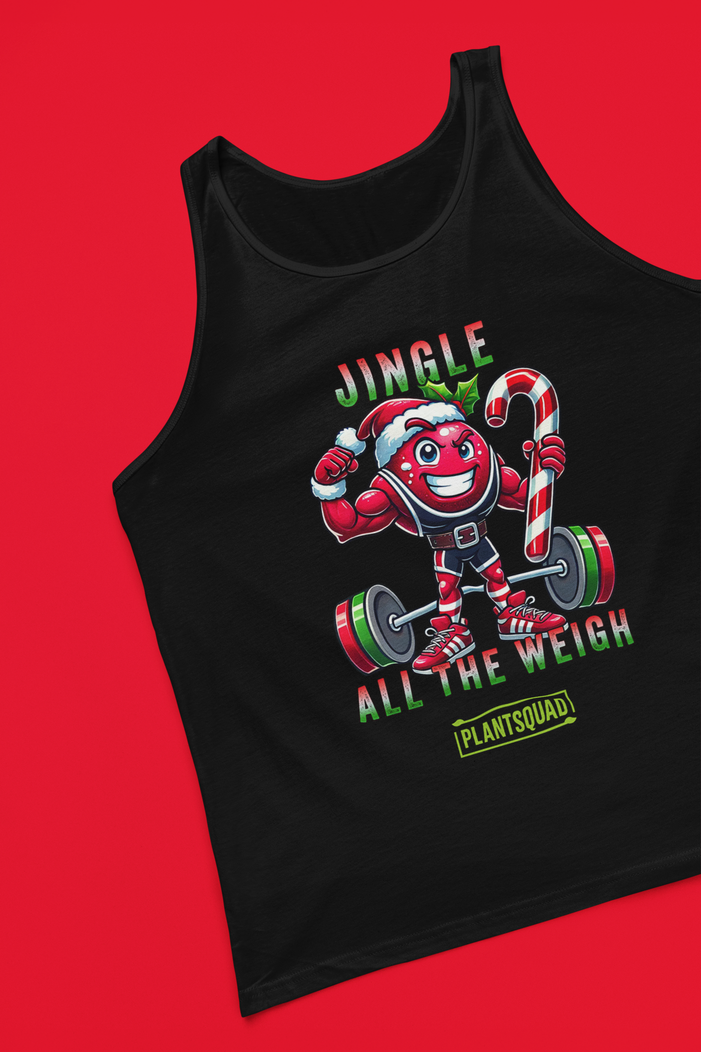 A picture of a tank top featuring a strong looking cranberry cartoon character flexing its arms holding a candy cane. A small green logo "PLANTSQUAD" appears above the character, "JINGLE ALL THE WEIGH" below. Perfect for those embracing a plant-based or vegan lifestyle that are into fitness