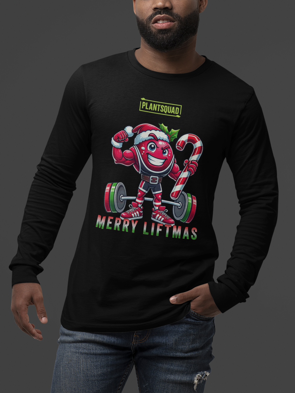A model featuring a muscled cranberry cartoon character flexing its arms holding a candy cane. A small green logo "PLANTSQUAD" appears above the character, "MERRY LIFTMAS" below. Perfect for those embracing a plant-based or vegan lifestyle that are into fitness