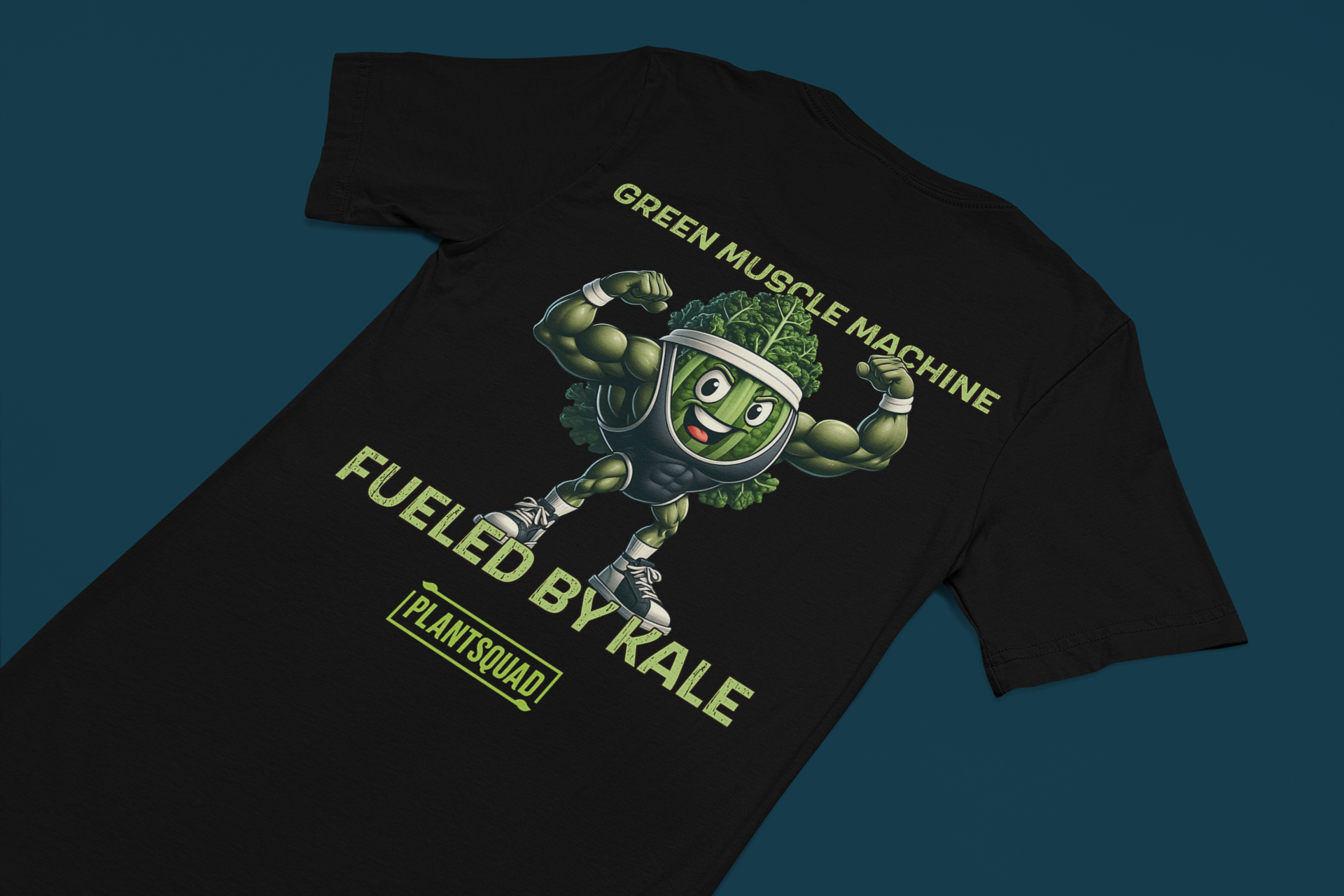 Plantsquad Kale "Green Muscle Machine Fueled By Kale" - Unisex T-Shirt featuring a cartoon kale character with muscular arms, flexing and smiling. The shirt displays the text "GREEN MUSCLE MACHINE" above the character and "FUELED BY KALE" below. Proudly wear your "PLANTSQUAD" mantra at the bottom of this unique design.