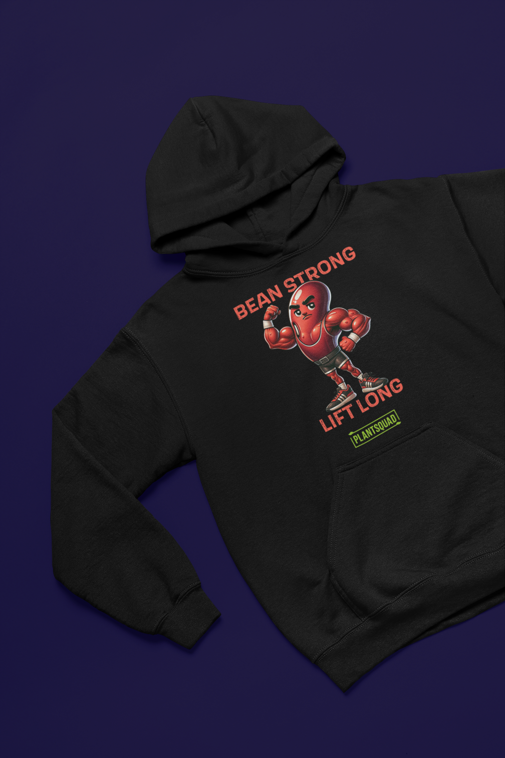 The Plantsquad Kidney Bean "Bean Strong Lift Long" - Unisex Hoodie features an image of a muscular kidney bean character donning boxing gloves and shoes. The text above reads "BEAN STRONG" and below it says "LIFT LONG." Representing the plant-based lifestyle, the logo "PLANTSQUAD" is at the bottom.
