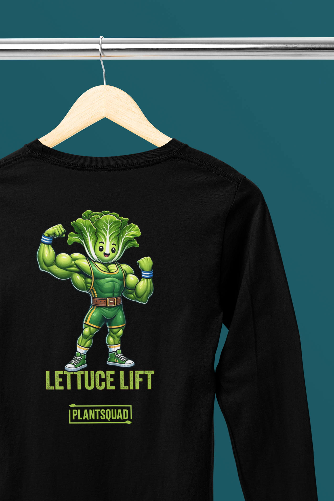 The Plantsquad Lettuce "Lettuce Lift" - Unisex Long Sleeve T-Shirt features a cartoon illustration of a muscular lettuce character flexing its arms. Below the character, the text reads "LETTUCE LIFT" in bold letters, with "PLANTSQUAD" written below in a smaller font—perfect for those embracing vegan fitness or a plant-based lifestyle.
