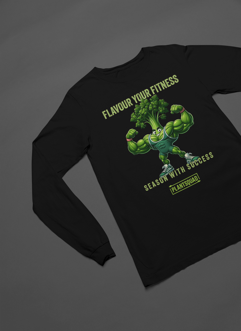 A black long-sleeve shirt with a cartoon image of a muscular broccoli flexing its arms. The text above reads "Flavour Your Fitness," and below the broccoli, it says "Season with Success." Embrace your plant-based lifestyle with this Plantsquad Parsley "Flavour Your Fitness Season With Success" - Unisex Long Sleeve T-Shirt, featuring a yellow box with "PLANTSQUAD" written inside.