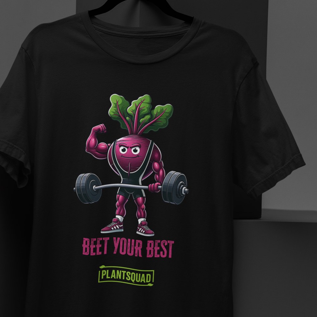 A black t-shirt hangs with a graphic of a cartoon beet lifting weights. The beet has muscular arms and legs, and wears sneakers. Above the beet, the text reads, "Beet Your Best." Below, it says "Plant Squad.