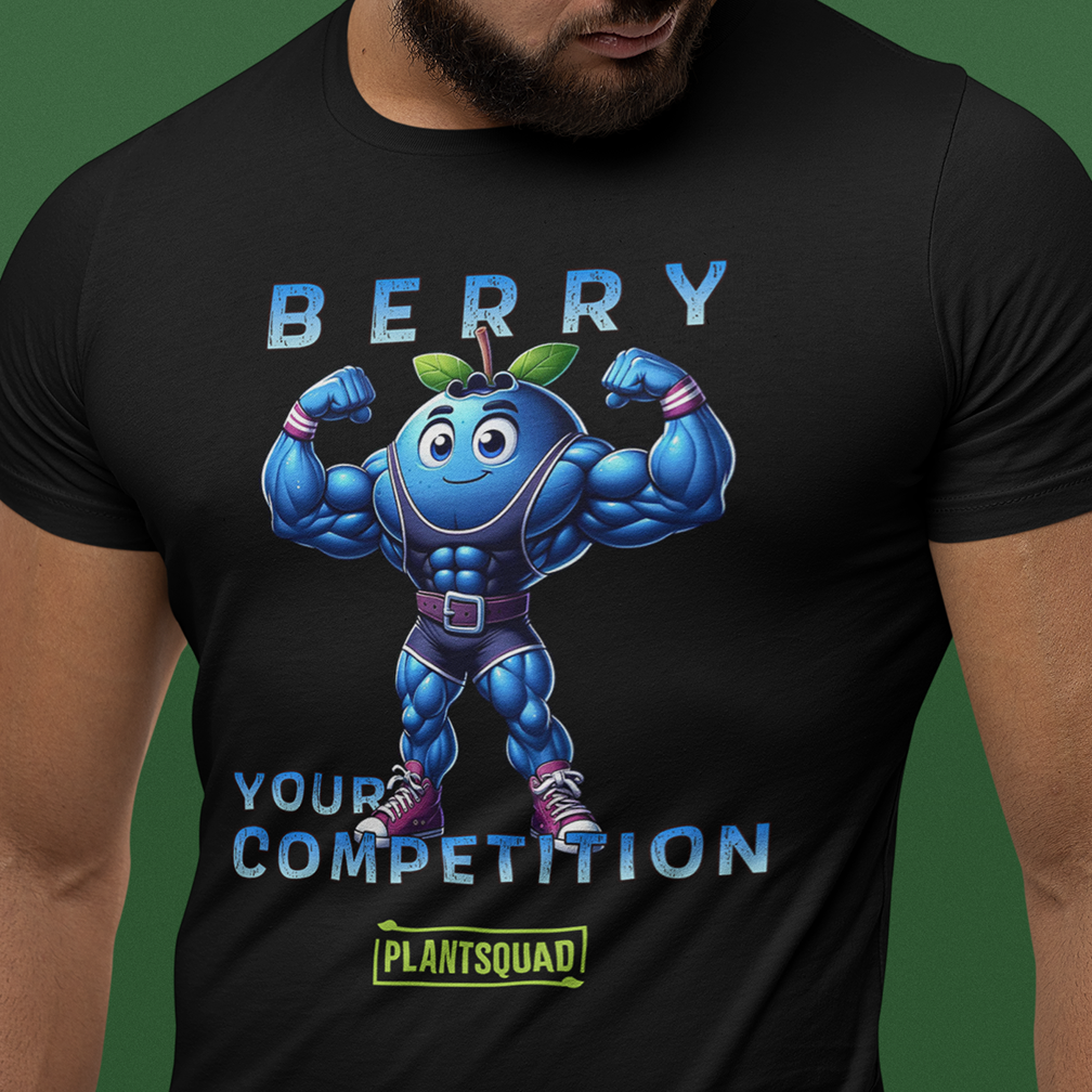 A muscular person wears a black t-shirt featuring a cartoon blueberry with bulging muscles, flexing its arms. The text on the shirt reads, "BERRY YOUR COMPETITION," with "PLANTSQUAD" written below the blueberry character.