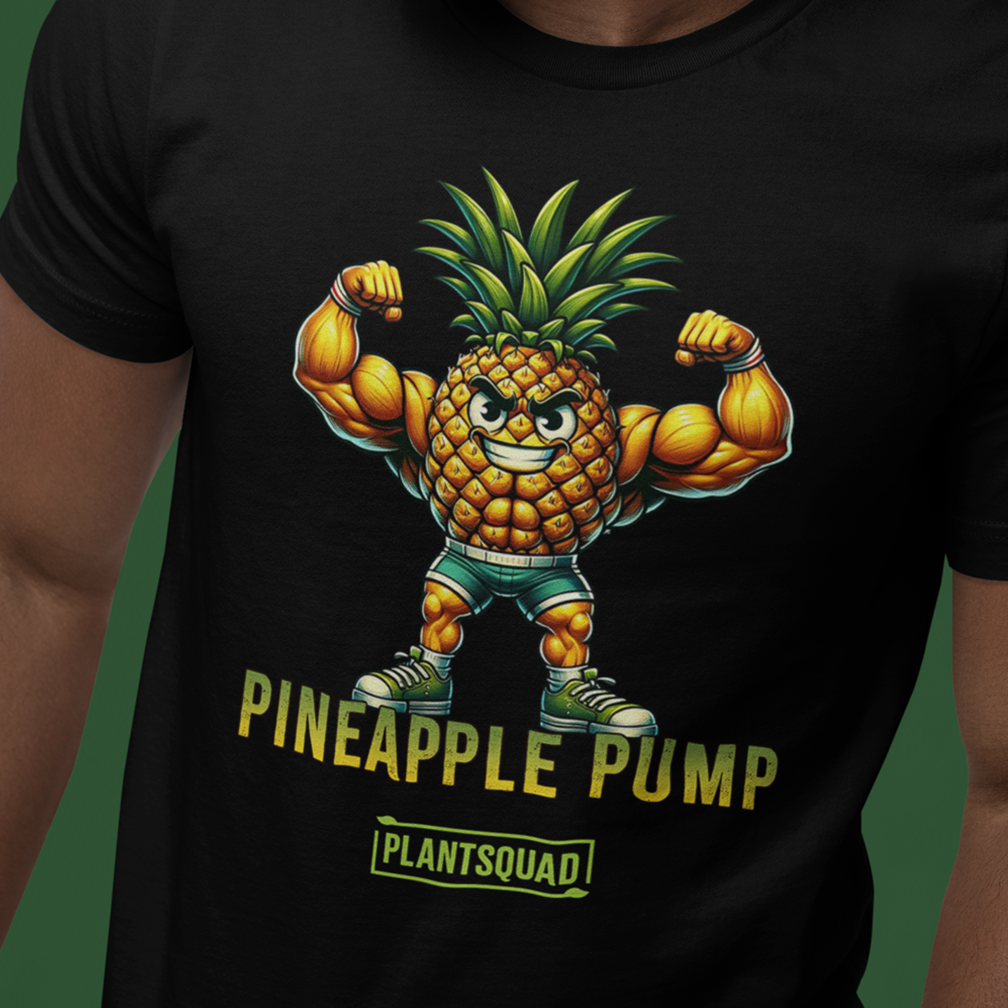 A person is wearing a black t-shirt with a muscular anthropomorphic pineapple character flexing its biceps. The pineapple is wearing green shorts and green sneakers. The text reads "Pineapple Pump" with "Plantsquad" in a green rectangular box below.