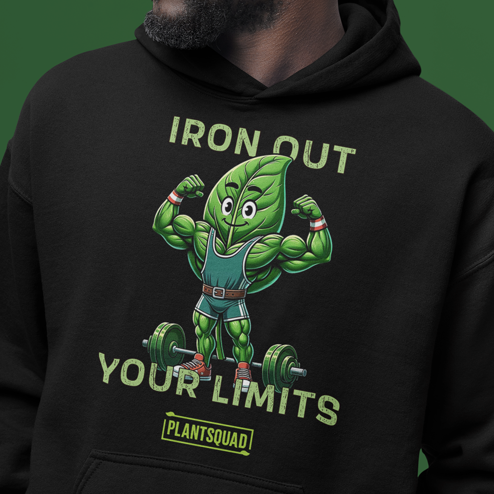 A person wearing a black hoodie adorned with a cartoon leaf character lifting weights. The words "IRON OUT YOUR LIMITS" are displayed above the character, and "PLANTSQUAD" is written at the bottom. The background is a solid green color.