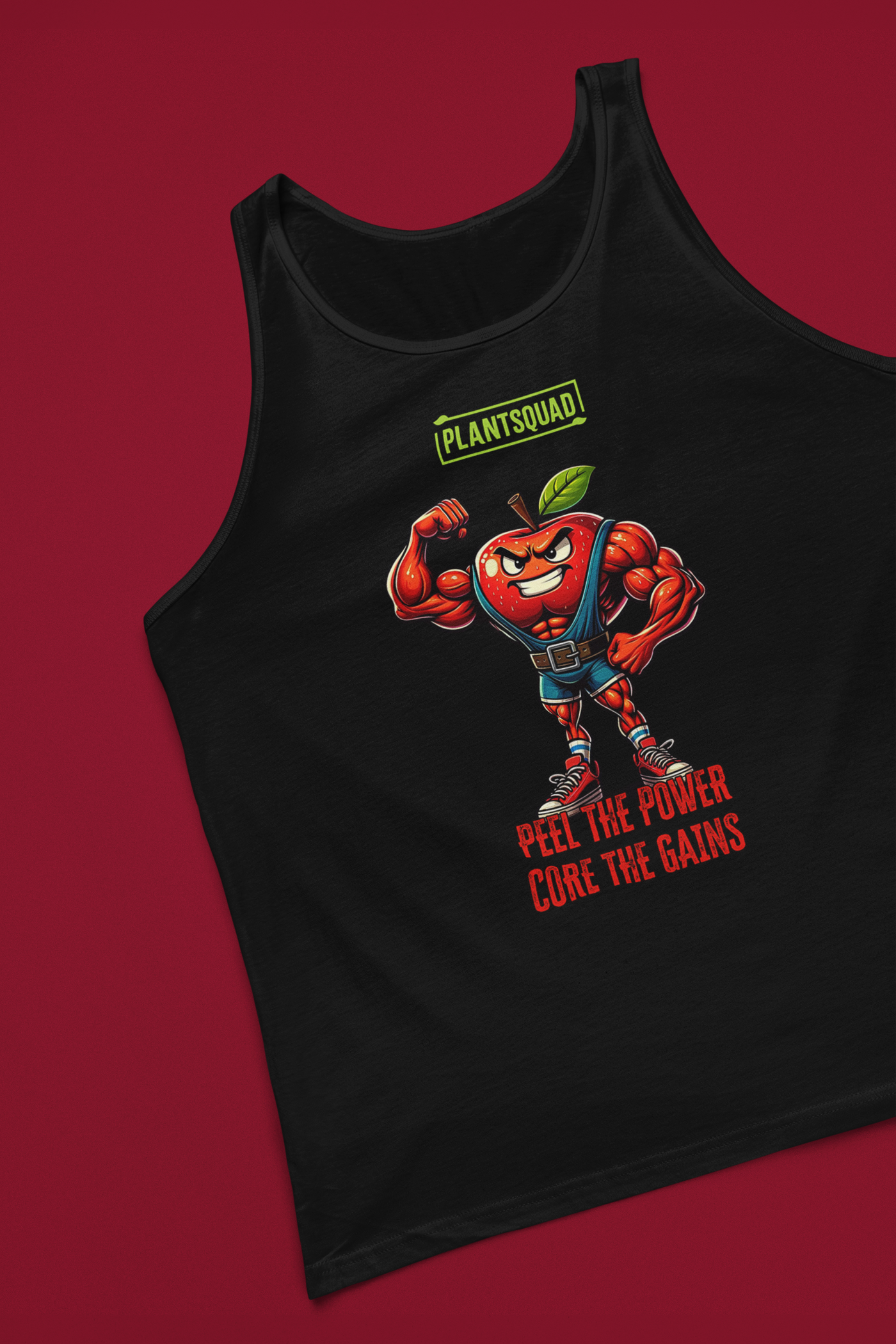 The Plantsquad Apple "Peel The Power Core The Gains" - Unisex Tank Top features a muscular anthropomorphic red apple character flexing its arm. Above it, the text reads "PLANTSQUAD," and below, "PEEL THE POWER, CORE THE GAINS" in bold letters. The apple character wears a weightlifting belt and sneakers, making it perfect for gym enthusiasts who prefer breathable fabric and a vegan lifestyle.