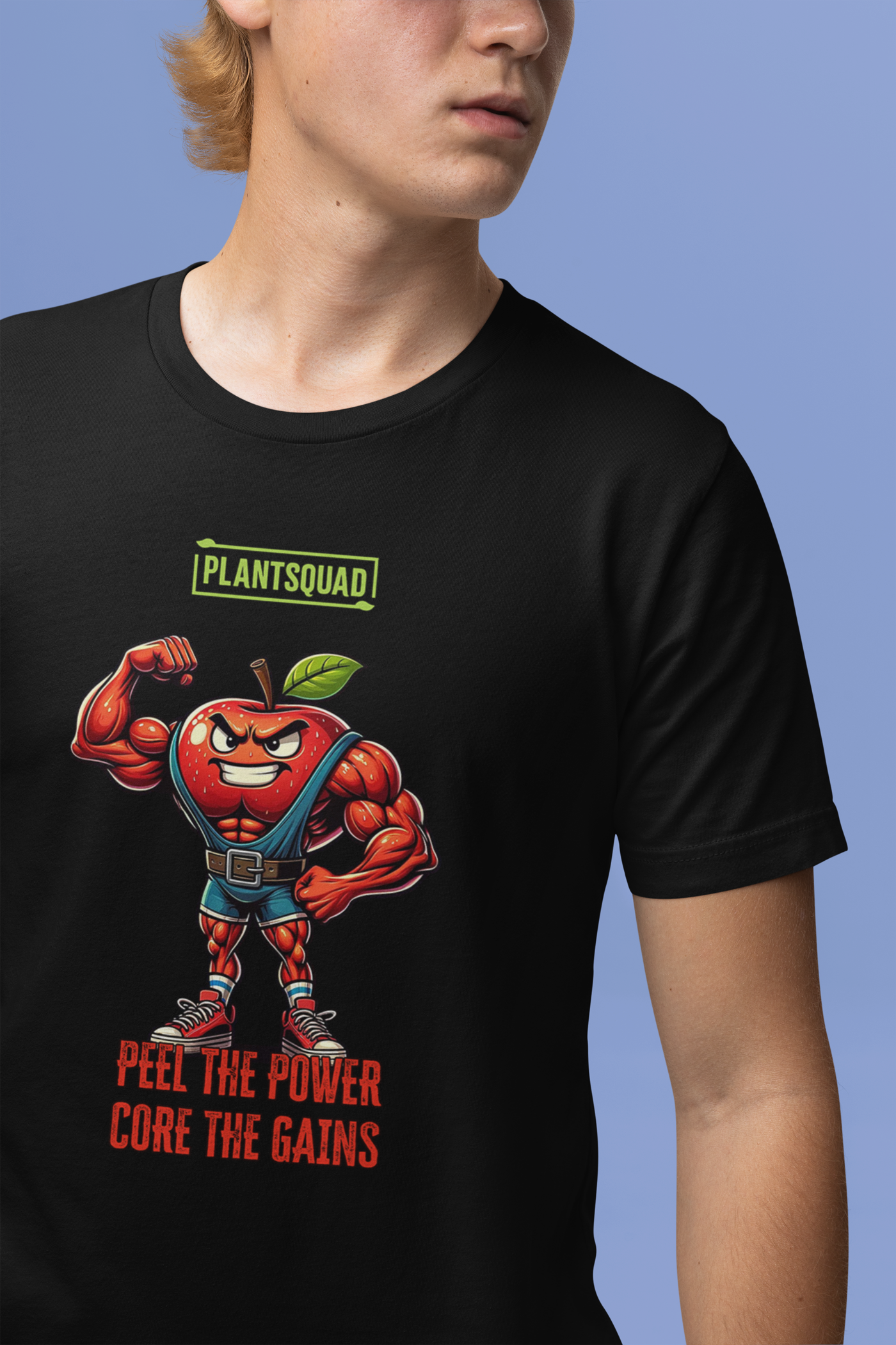 The Plantsquad Apple "Peel The Power Core The Gains" - Unisex T-Shirt features a muscular, anthropomorphic apple character wearing a weightlifter belt and boots, flexing its right arm. Above the apple is the text "PLANTSQUAD," and below it reads "PEEL THE POWER, CORE THE GAINS" in bold red and orange text.