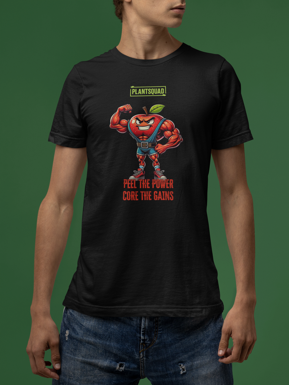 The Plantsquad Apple "Peel The Power Core The Gains" - Unisex T-Shirt features a muscular, anthropomorphic apple character wearing a weightlifter belt and boots, flexing its right arm. Above the apple is the text "PLANTSQUAD," and below it reads "PEEL THE POWER, CORE THE GAINS" in bold red and orange text.