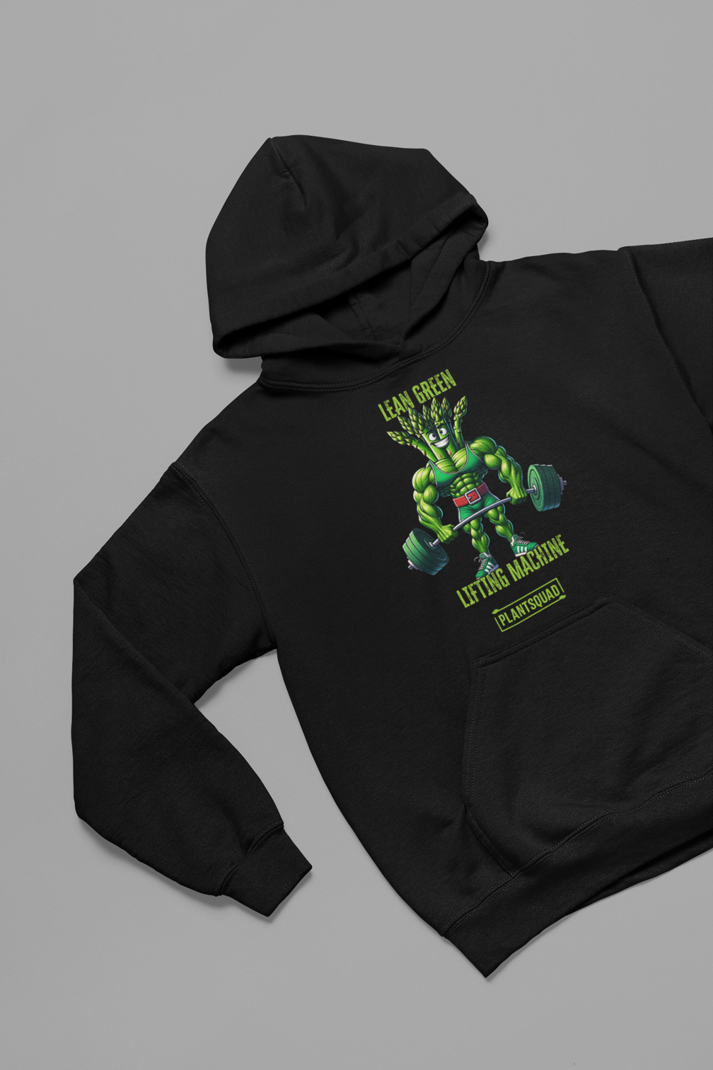 A black weight lifting hoodie featuring a muscular, green, humanoid plant character lifting two large dumbbells. Above the character are the words "Lean Green Lifting Machine" in green, and "PLANT SQUAD" is written below. Perfect vegan gym apparel for those embracing a plant-based lifestyle. Introducing the Plantsquad Asparagus "Lean Green Lifting Machine" - Unisex Hoodie.