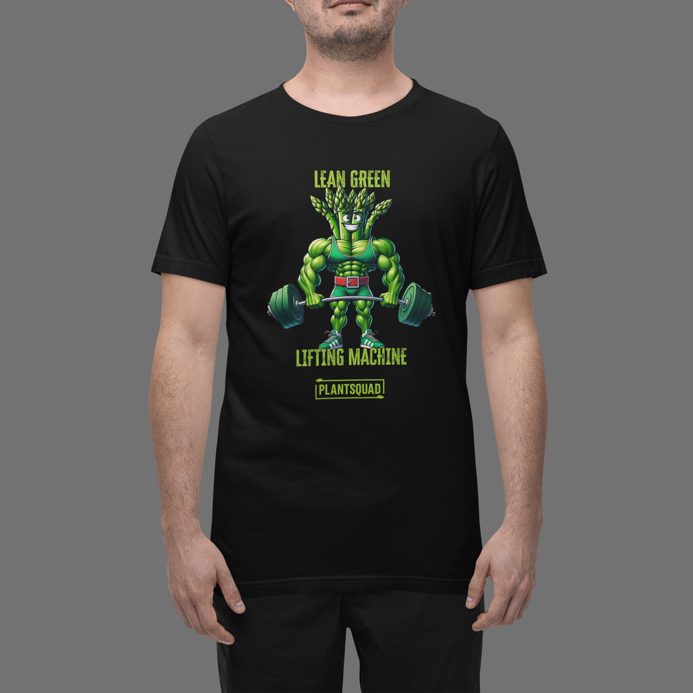 A black T-shirt featuring a muscular green creature holding barbells, under the text "LEAN GREEN LIFTING MACHINE." Below the graphic, a text box proudly reads "Plantsquad Asparagus 'Lean Green Lifting Machine' - Unisex T-Shirt" to represent your team.