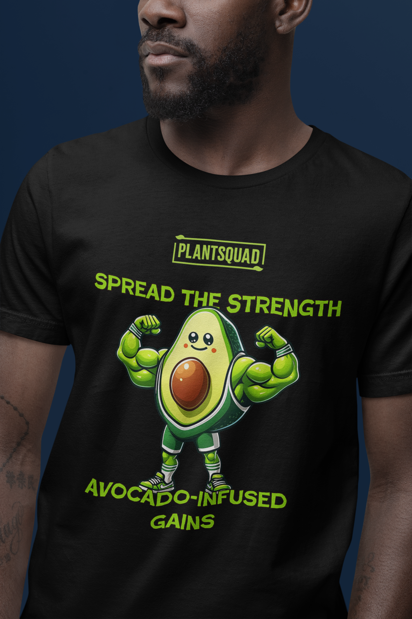 A black Plantsquad Avocado "Spread The Strength Avocado-Infused Gains" - Unisex T-Shirt featuring a muscular, cartoon avocado character with fists raised. Text above and below the character reads "PLANTSQUAD," "SPREAD THE STRENGTH," and "AVOCADO-INFUSED GAINS" in bright green lettering.