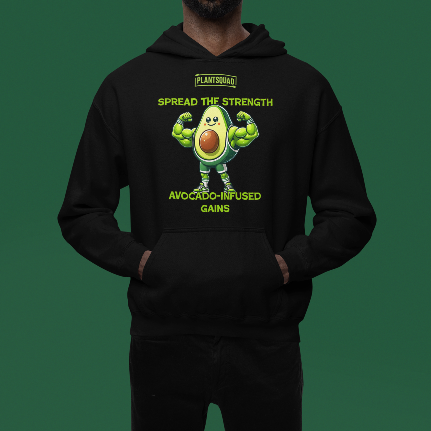 The **Plantsquad Avocado "Spread The Strength Avocado-Infused Gains" - Unisex Hoodie** features a smiling, muscular avocado character with flexed arms. Above it, the text reads "PLANTSQUAD." Below, in bright green letters: "SPREAD THE STRENGTH AVOCADO-INFUSED GAINS." Ideal for anyone embracing a vegan lifestyle and loving an avocado design.