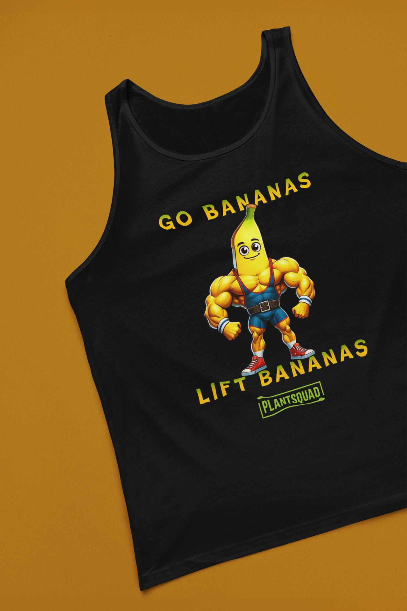 A Plantsquad Banana "Go Bananas Lift Bananas" - Unisex Tank Top featuring a cartoon banana character with a muscular body. The banana is wearing a weightlifting belt and black shorts. The text reads "GO BANANAS LIFT BANANAS" in yellow, with a small green box below containing the word "PLANTSQUAD." Perfect for gym enthusiasts embracing a plant-based lifestyle.