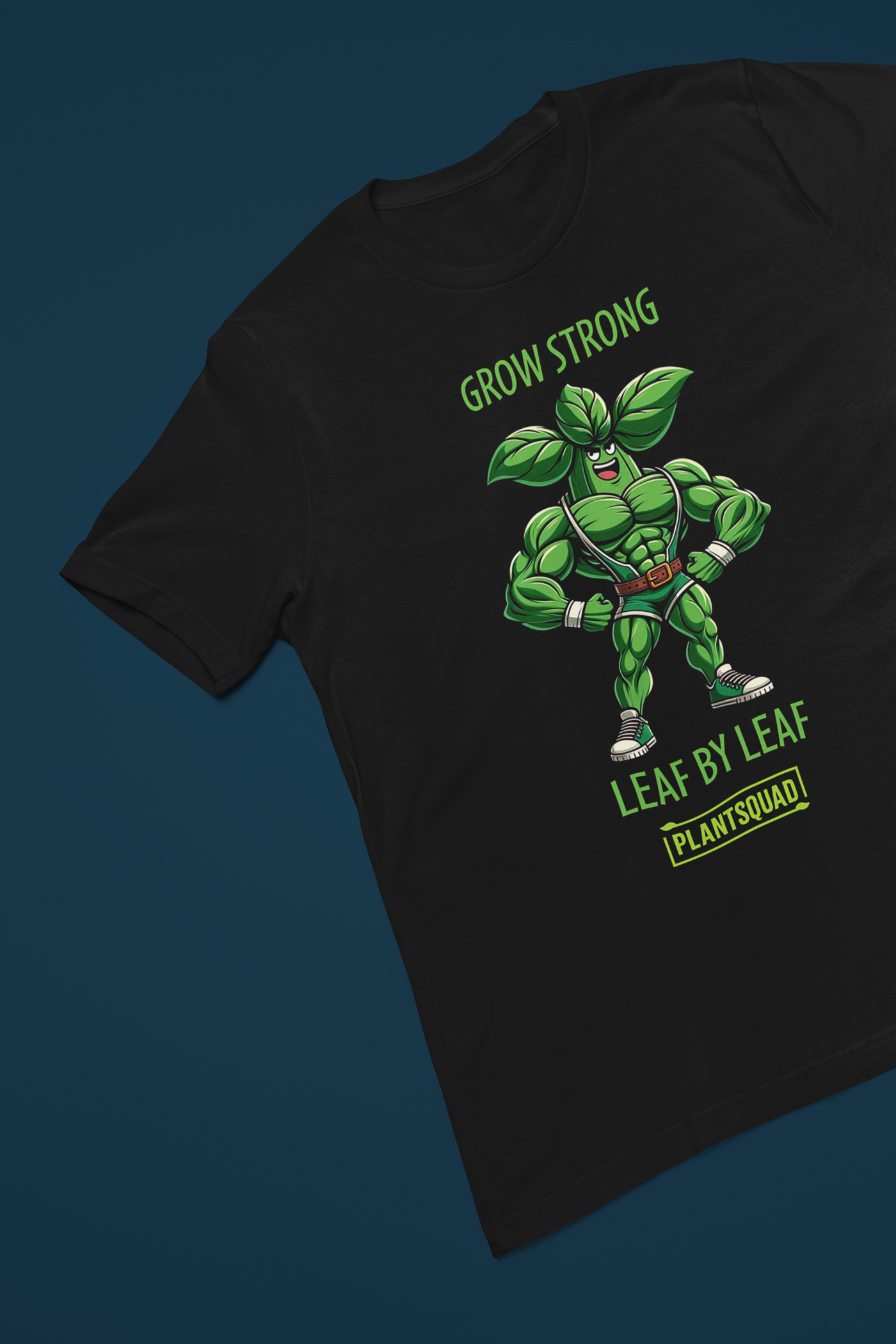 Plantsquad Basil "Grow Strong Leaf By Leaf" - Unisex T-Shirt featuring a muscular green superhero with leaves for ears and as part of his costume. Text above reads "Grow Strong" and below it says "Leaf By Leaf." The Plantsquad logo is proudly displayed at the bottom.