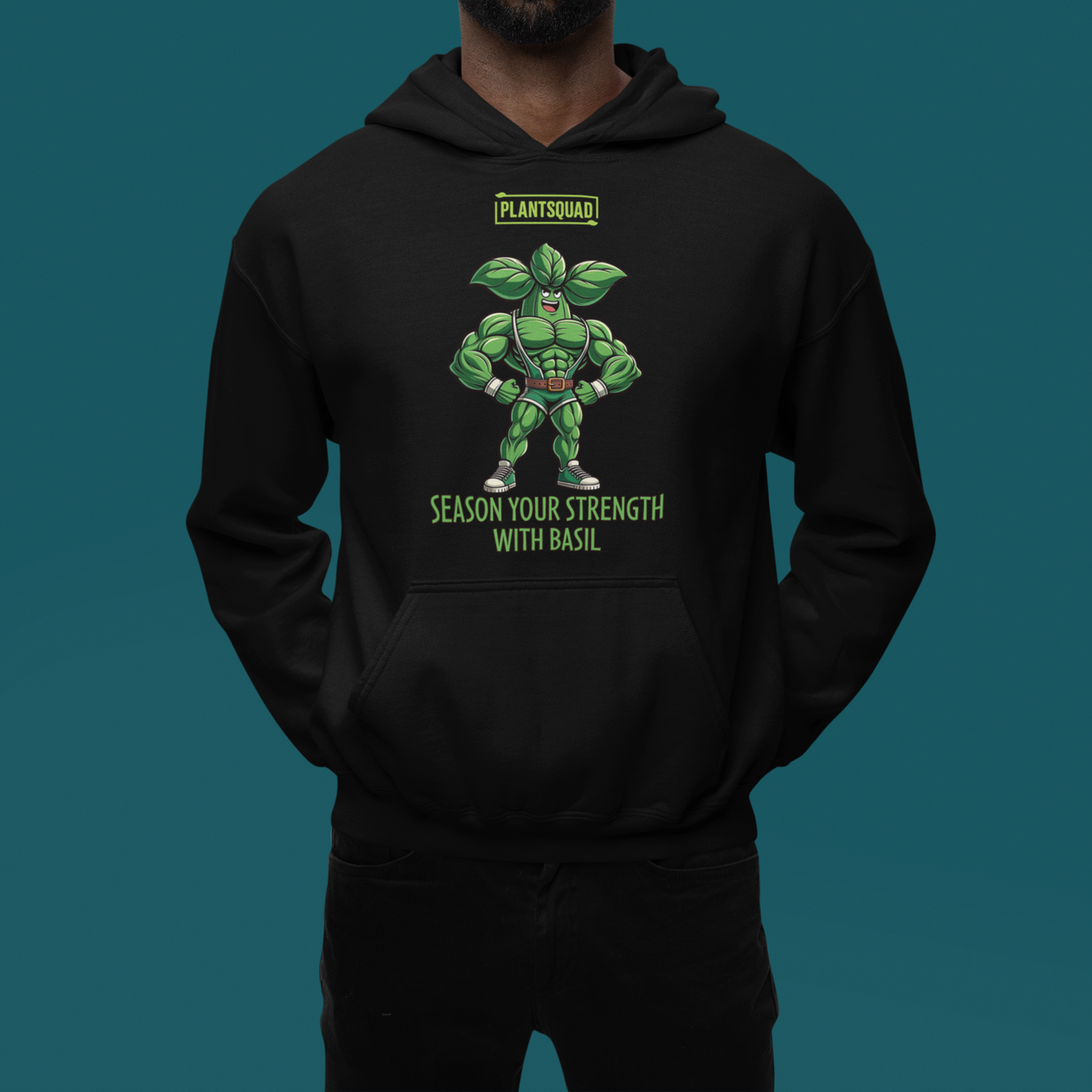 The Plantsquad Basil "Season Your Strength With Basil" - Unisex Hoodie features a muscular cartoon basil character, aptly named Basil, standing with arms crossed. Above Basil, a green logo reads "PLANTSQUAD." Below him, the text says, "SEASON YOUR STRENGTH WITH BASIL." Embrace the vegan lifestyle and cozy fabric while flaunting your love for weight lifting.