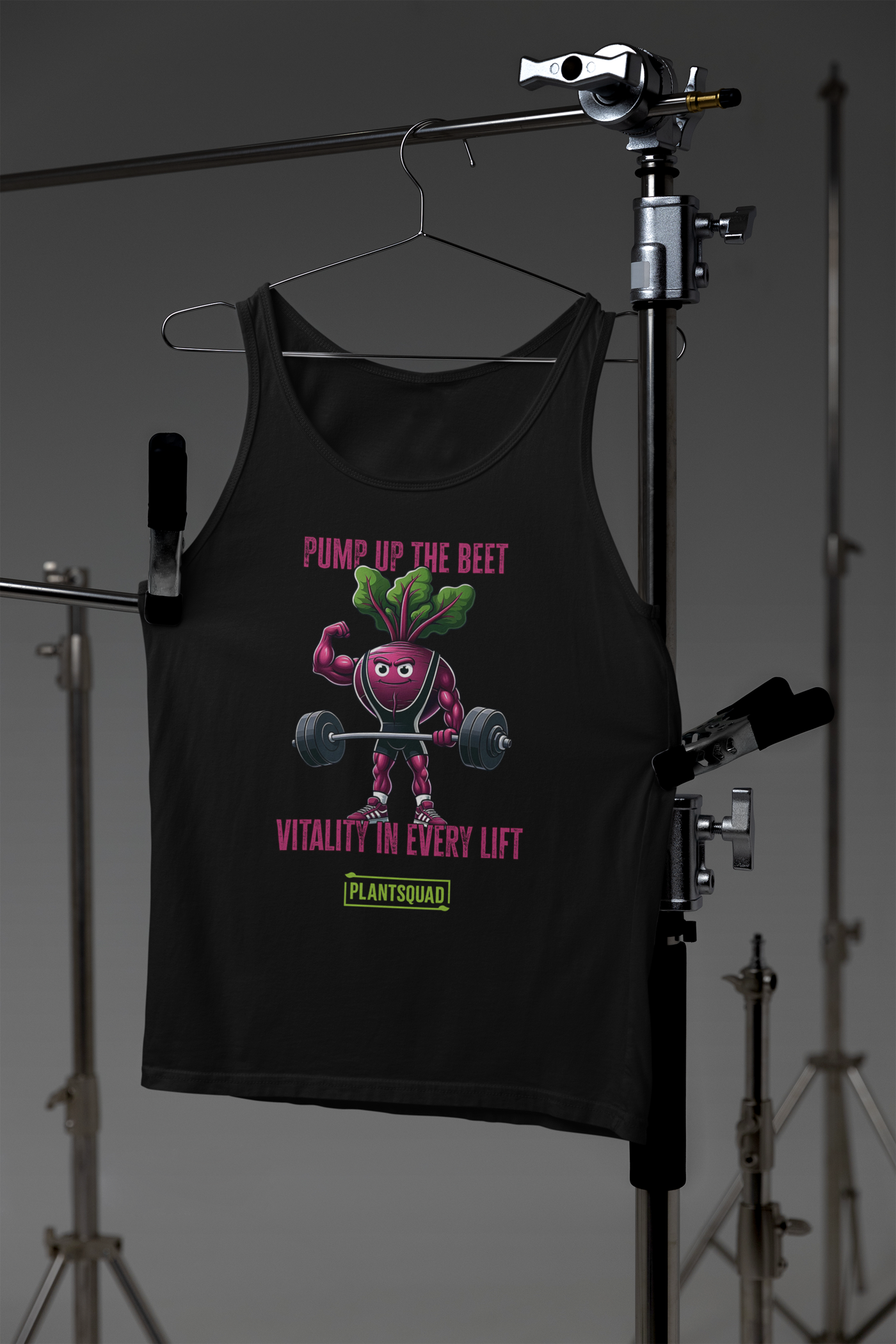 A black tank top featuring a muscular cartoon beet lifting a barbell. Text above the beet reads "PUMP UP THE BEET," and text below reads "VITALITY IN EVERY LIFT." Crafted from breathable fabric, it's perfect for gym enthusiasts embracing a vegan lifestyle. The "PLANTSQUAD" logo is at the bottom. The beet has green leaves for hair.

Product Name: Plantsquad Beetroot "Pump Up The Beet Vitality In Every Lift" - Unisex Tank Top