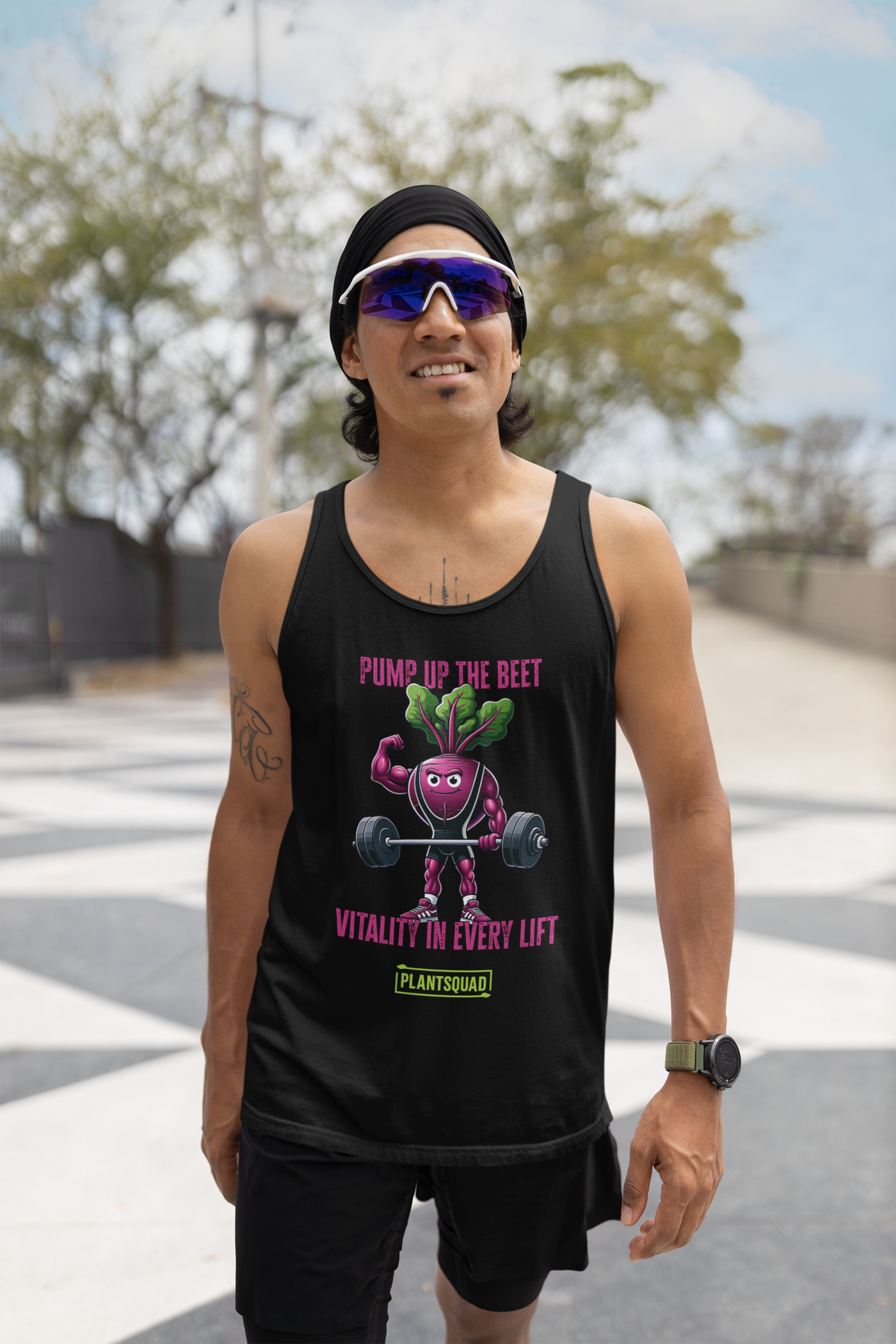 A black tank top featuring a muscular cartoon beet lifting a barbell. Text above the beet reads "PUMP UP THE BEET," and text below reads "VITALITY IN EVERY LIFT." Crafted from breathable fabric, it's perfect for gym enthusiasts embracing a vegan lifestyle. The "PLANTSQUAD" logo is at the bottom. The beet has green leaves for hair.

Product Name: Plantsquad Beetroot "Pump Up The Beet Vitality In Every Lift" - Unisex Tank Top