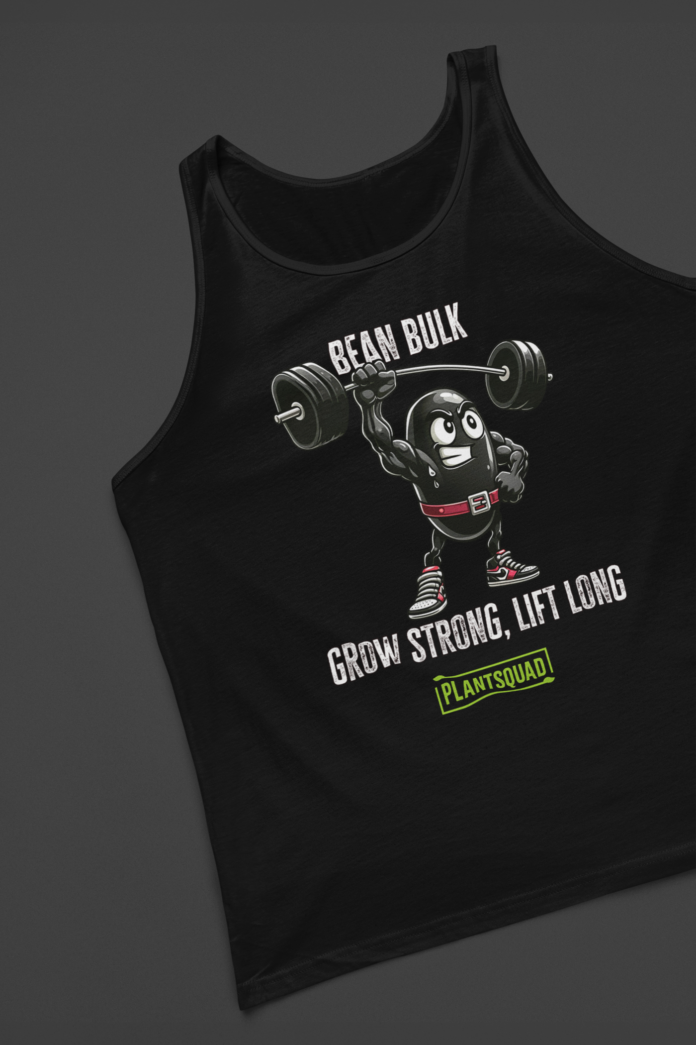 The Plantsquad Black Bean "Bean Bulk Grow Strong Lift Long" - Unisex Tank Top features a cartoon bean character lifting a barbell with the text "BEAN BULK" above and "GROW STRONG, LIFT LONG" below. Perfect for gym enthusiasts embracing a plant-based lifestyle, it has the logo "PLANTSQUAD" in green at the bottom. The bean wears red gloves, a red belt, and red shoes.