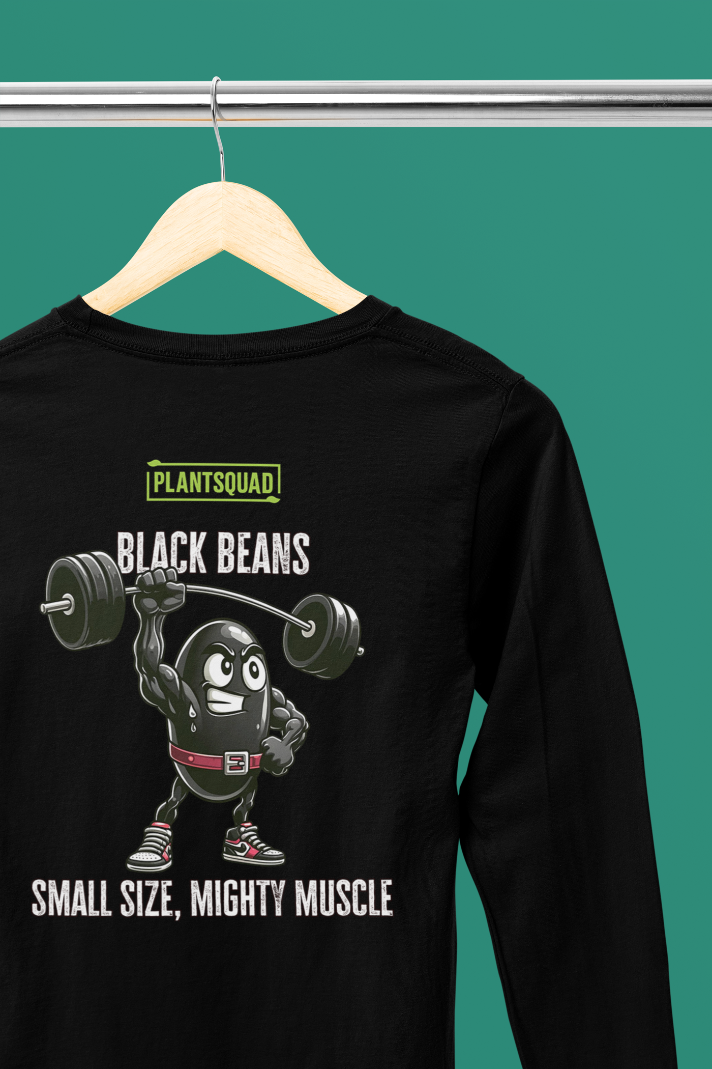 A Plantsquad Black Bean "Black Beans Small Size Mighty Muscle" - Unisex Long Sleeve T-Shirt featuring a graphic of a muscular black bean lifting weights. The top text reads "PLANTSQUAD," followed by "BLACK BEANS" in bold. Below the bean, it says "SMALL SIZE, MIGHTY MUSCLE." Perfect for fitness enthusiasts living a vegan lifestyle.