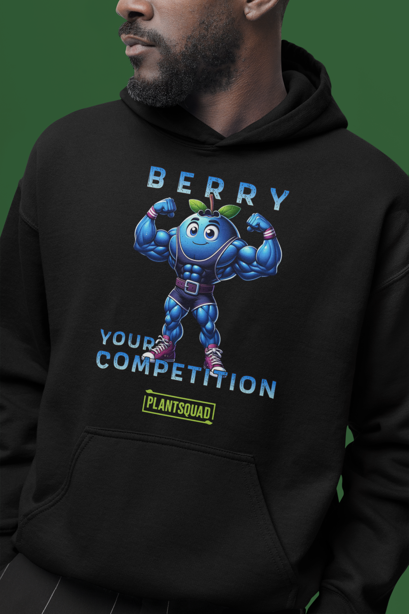 This Plantsquad Blueberry "Berry Your Competition" - Unisex Hoodie features a muscular blueberry cartoon flexing its arms. Above, the text reads "BERRY," and below, "YOUR COMPETITION" is written. A small green and yellow label with the word "PLANTSQUAD" is at the bottom, perfect for those embracing a plant-based lifestyle.