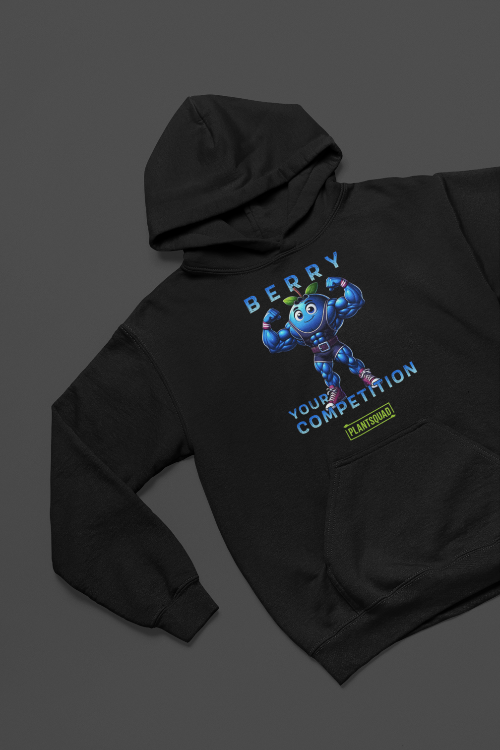 This Plantsquad Blueberry "Berry Your Competition" - Unisex Hoodie features a muscular blueberry cartoon flexing its arms. Above, the text reads "BERRY," and below, "YOUR COMPETITION" is written. A small green and yellow label with the word "PLANTSQUAD" is at the bottom, perfect for those embracing a plant-based lifestyle.