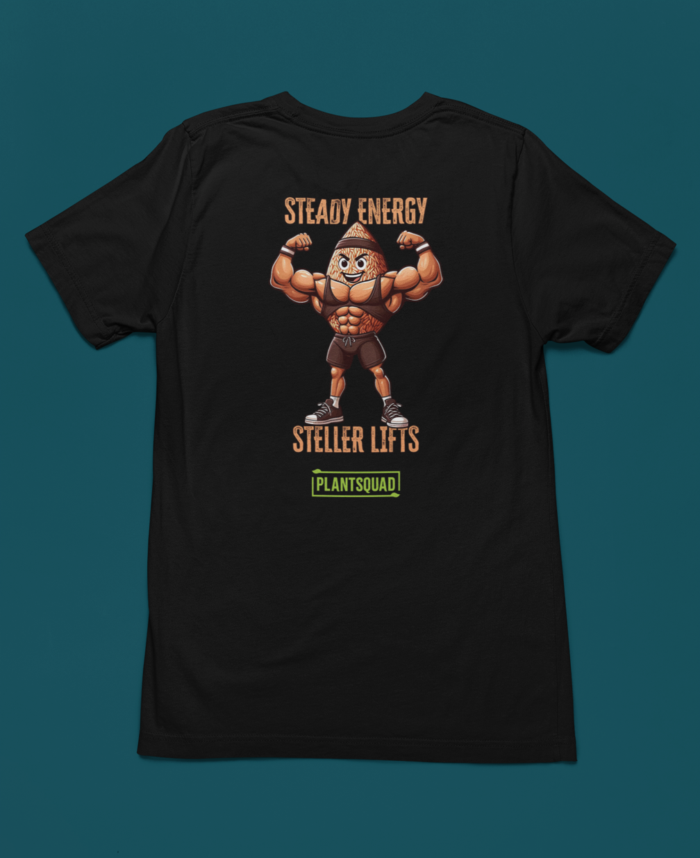 A black t-shirt features an illustration of a muscular peanut character flexing its arms. Above the character, text reads "STEADY ENERGY," and below, text reads "STELLAR LIFTS." A green box at the bottom proudly displays the word "Plantsquad Brown Rice 'Steady Energy Stellar Lifts' - Unisex T-Shirt.