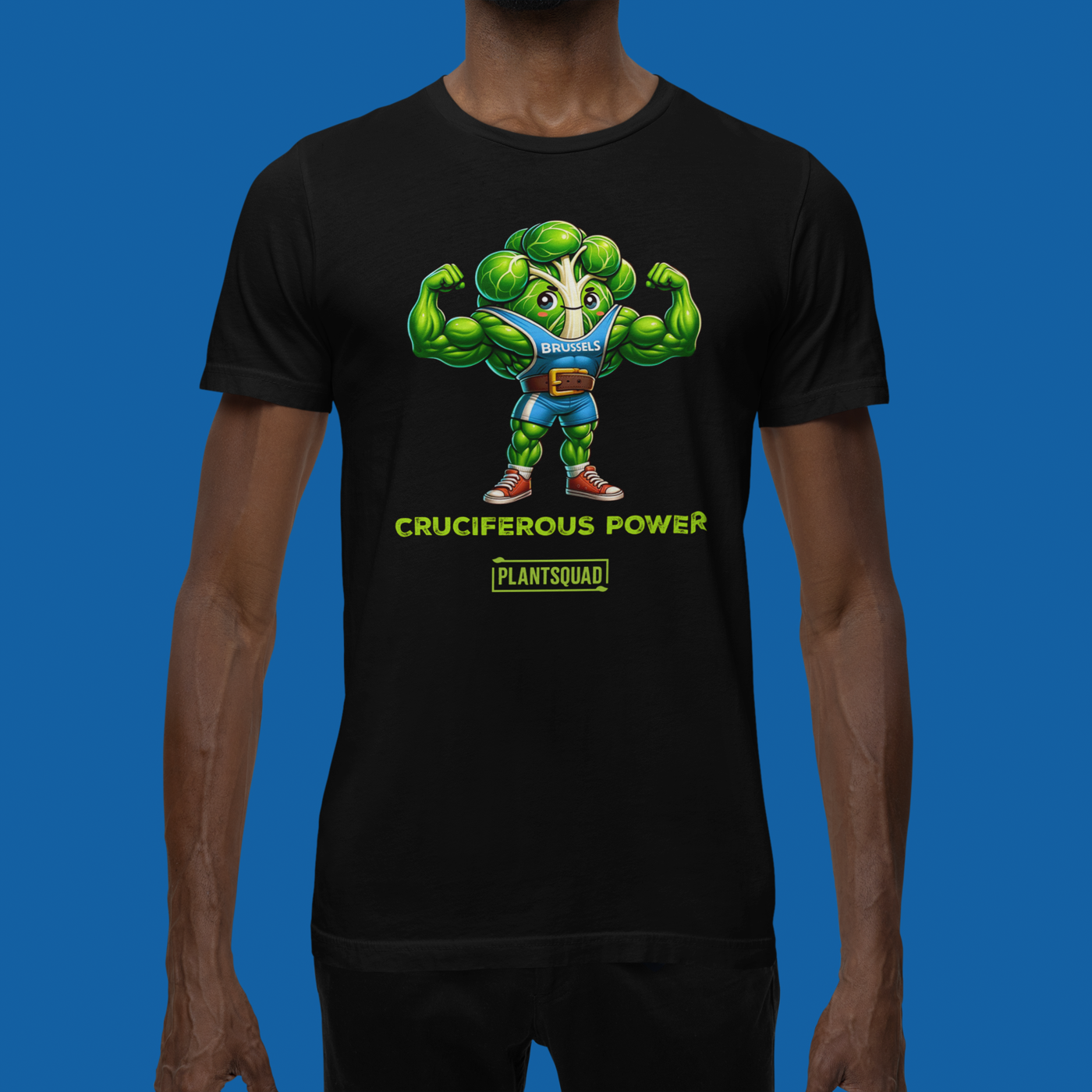 A Plantsquad Brussel Sprout "Cruciferous Power" - Unisex T-Shirt features a muscular cartoon broccoli character in a blue top flexing its biceps. Below the character, bold text reads "CRUCIFEROUS POWER", while underneath in smaller text is the keyword hashtag "plantsquad".