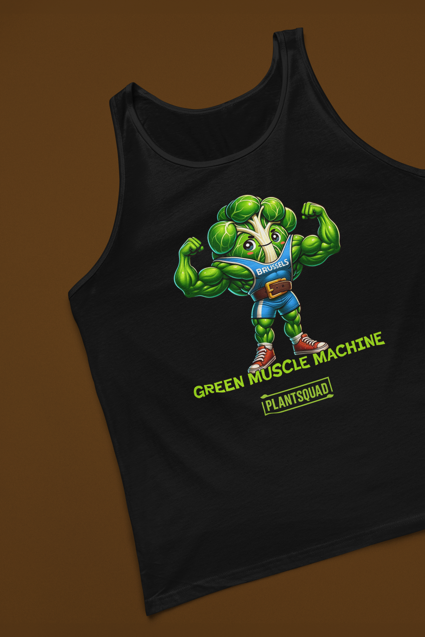 The Plantsquad Brussel Sprout "Green Muscle Machine" - Unisex Tank Top features a muscular, anthropomorphic Brussels sprout character flexing its arms. The character wears a blue shirt with "Brussels" on it. Below, the text reads "GREEN MUSCLE MACHINE" and "PLANTSQUAD." Perfect for gym enthusiasts who embrace the vegan lifestyle.