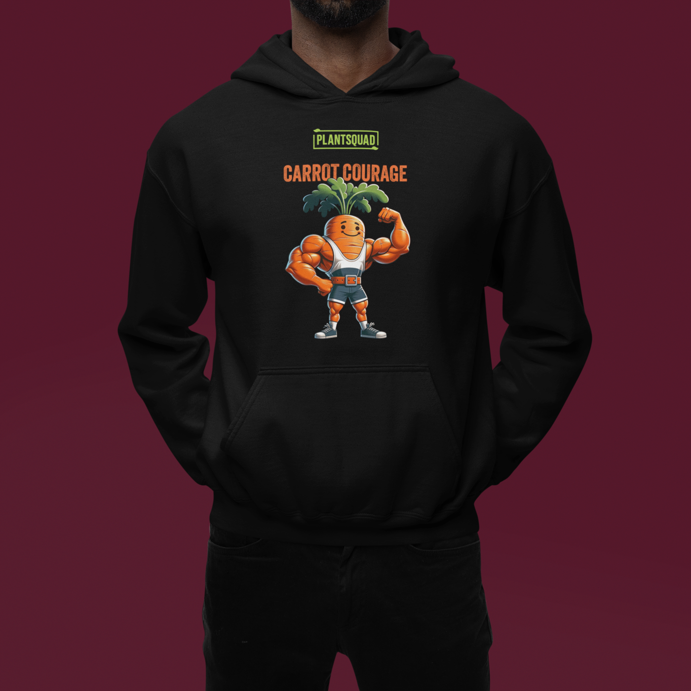 A Plantsquad Carrot "Carrot Courage" - Unisex Hoodie featuring a cartoon image of a muscular carrot character with green leafy hair, flexing its arms. Above the carrot, the text reads "PLANTSQUAD" and "CARROT COURAGE" in bold letters, perfect for those embracing the vegan lifestyle.