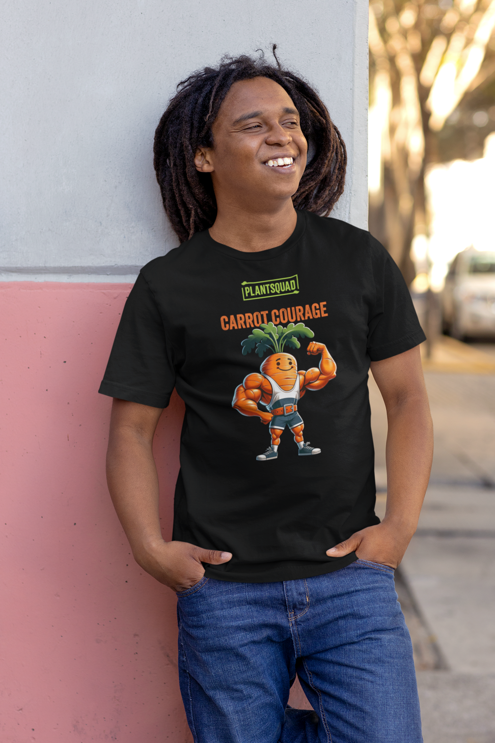 Plantsquad Carrot "Carrot Courage" - Unisex T-Shirt featuring a muscular carrot character flexing its muscles, with "PLANTSQUAD" boldly above and "CARROT COURAGE" below. The carrot sports a smiling face and green leafy hair, proudly representing the plantsquad.