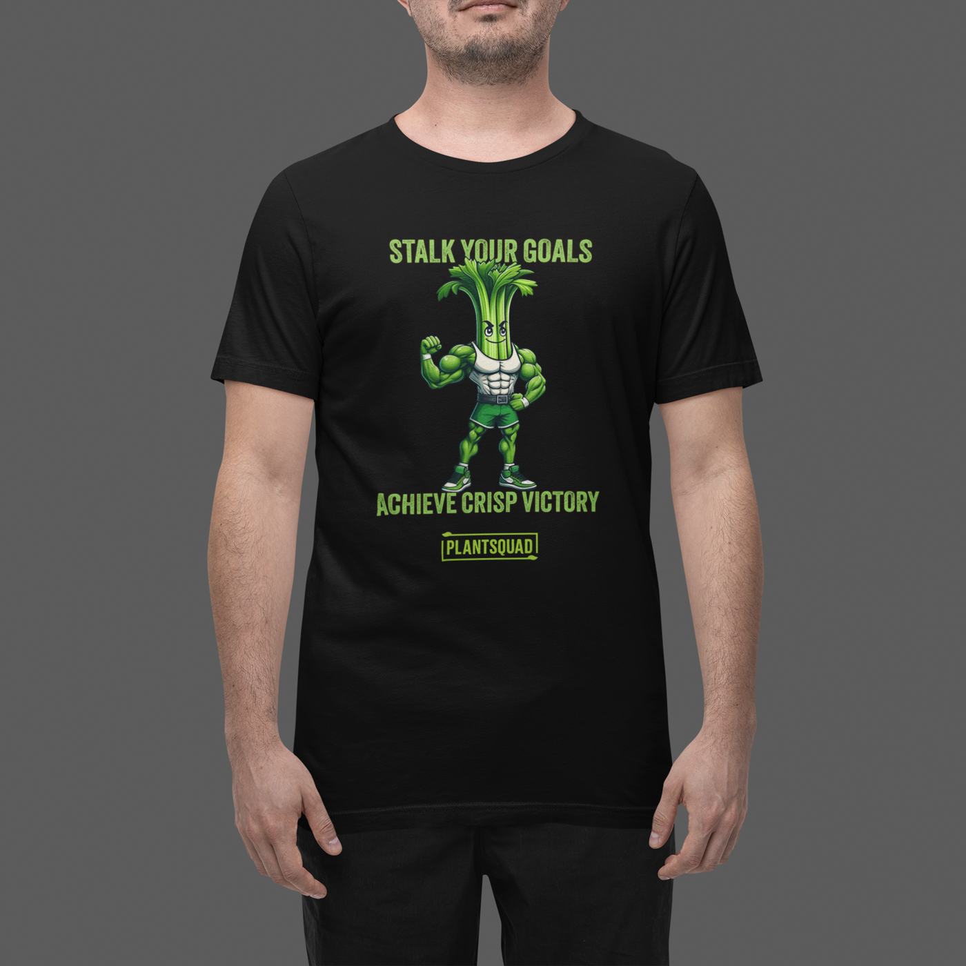 A Plantsquad Celery "Stalk Your Goals Achieve Crisp Victory" - Unisex T-Shirt featuring an illustration of a muscular celery stalk character flexing its arm. The shirt proudly displays "STALK YOUR GOALS" at the top and "ACHIEVE CRISP VICTORY" below the character, with "PLANTSQUAD" showcased in a box at the bottom. Perfect for any plantsquad enthusiast!