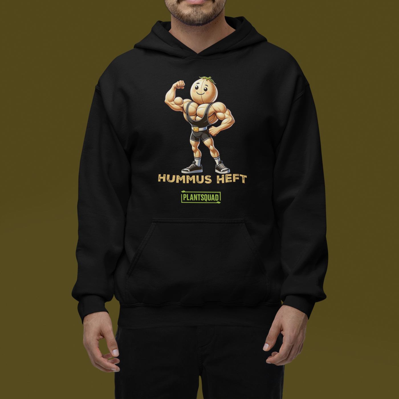 The Plantsquad Chickpea "Hummus Heft" - Unisex Hoodie features a black hooded sweatshirt with a cartoon hummus mascot flexing its biceps, embodying the weight-lifting chickpea spirit. The text "Hummus Heft" is printed below the character, with "PLANTSQUAD" in a green box underneath, perfect for showcasing your vegan lifestyle.