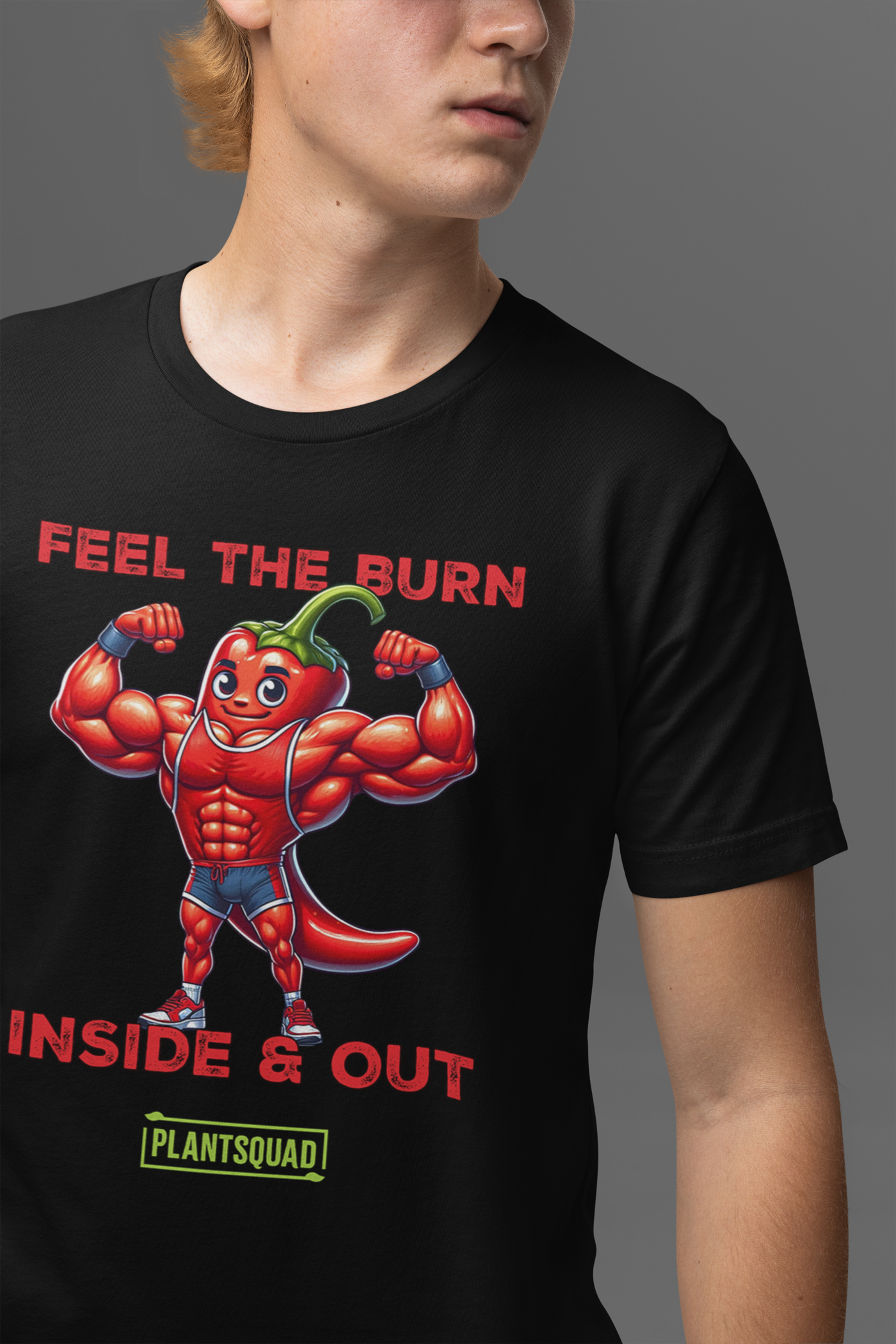 A black T-shirt showcases a muscular, flexing chili pepper character above bold red and white text that reads "FEEL THE BURN INSIDE & OUT". Below this, "Plantsquad Chilli 'Feel The Burn Inside & Out' - Unisex T-Shirt" is prominently featured inside a green rectangular box.