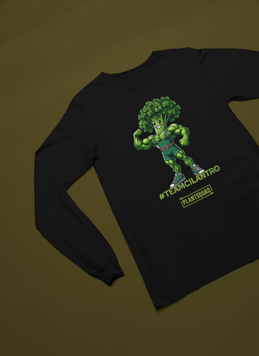 Here's the revised sentence:

A Plantsquad Cilantro "Team Cilantro" - Unisex Long Sleeve T-Shirt featuring an illustration of a muscular anthropomorphic broccoli character wearing a championship belt. Perfect for fitness enthusiasts, the text "#TEAMCILANTRO" is prominently displayed below the character, along with "PLANTSQUAD" in a green box beneath it.