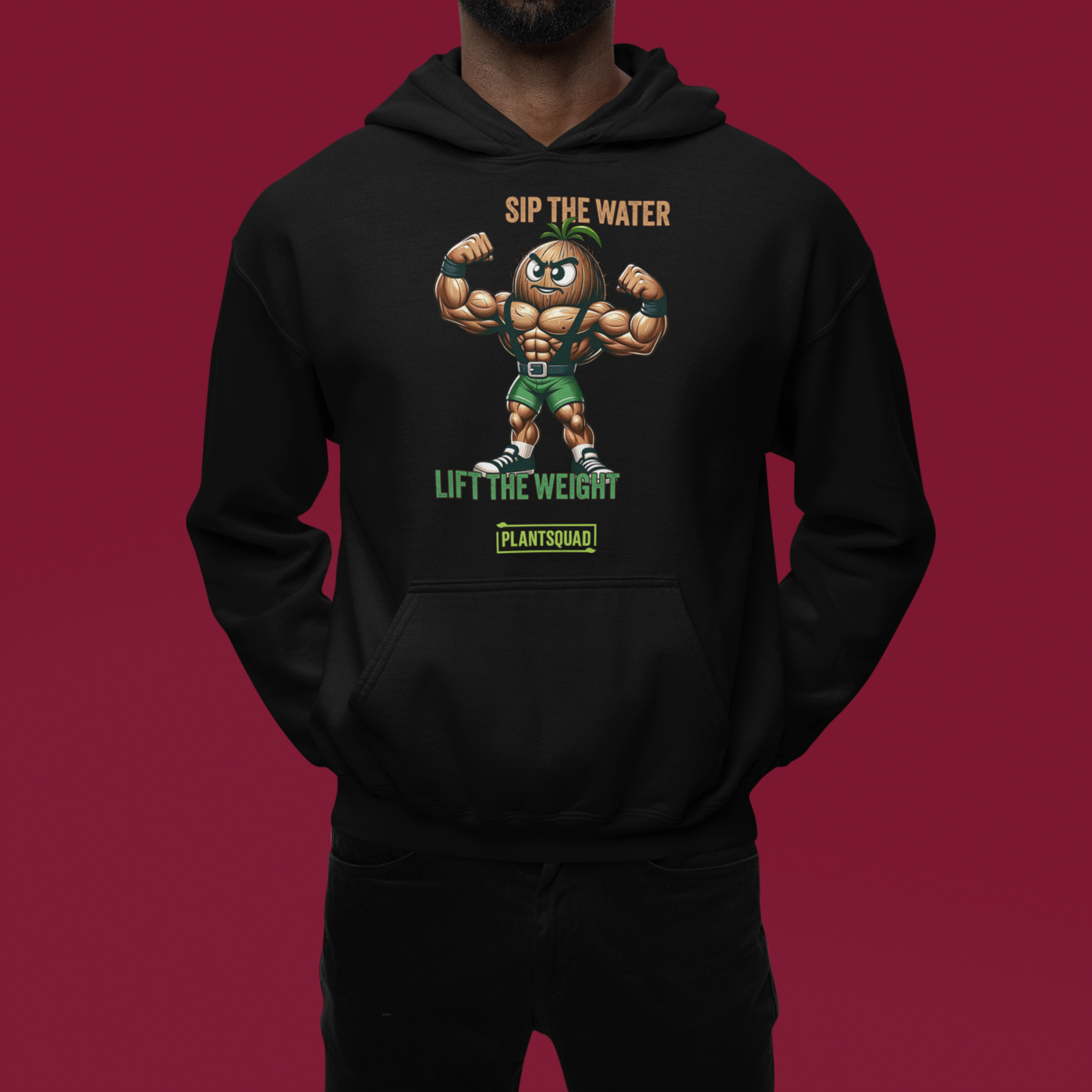 A Plantsquad Coconut "Sip The Water Lift The Weight" - Unisex Hoodie featuring a muscular cartoon nut flexing its biceps. Above the character, the text reads "SIP THE WATER." Below, it says "LIFT THE WEIGHT" with "PLANTSQUAD" at the bottom. Made from cozy fabric, it's perfect for anyone embracing a vegan lifestyle and passionate about weight lifting.