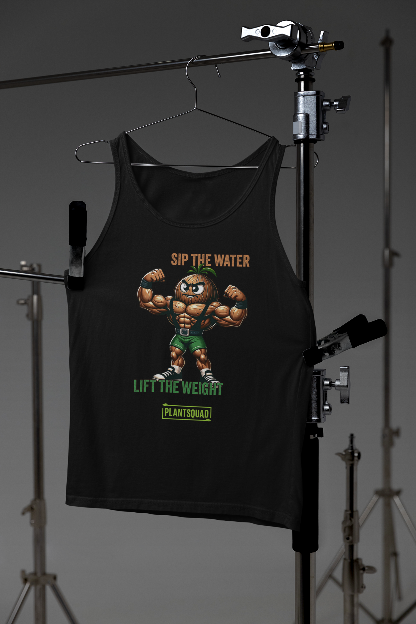 A black Plantsquad Coconut "Sip The Water Lift The Weight" - Unisex Tank Top featuring a muscular cartoon broccoli flexing its biceps. It has the text "SIP THE WATER" in orange, "LIFT THE WEIGHT" in green, and "PLANTSQUAD" in a green box at the bottom. Perfect for gym enthusiasts embracing a plant-based lifestyle.