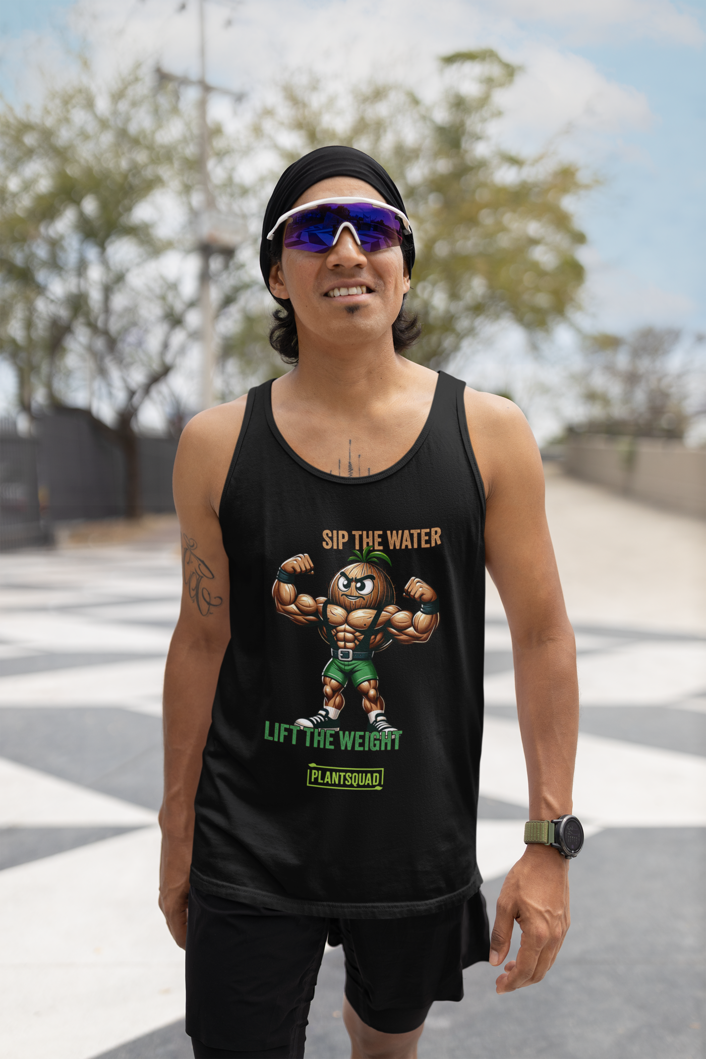 A black Plantsquad Coconut "Sip The Water Lift The Weight" - Unisex Tank Top featuring a muscular cartoon broccoli flexing its biceps. It has the text "SIP THE WATER" in orange, "LIFT THE WEIGHT" in green, and "PLANTSQUAD" in a green box at the bottom. Perfect for gym enthusiasts embracing a plant-based lifestyle.