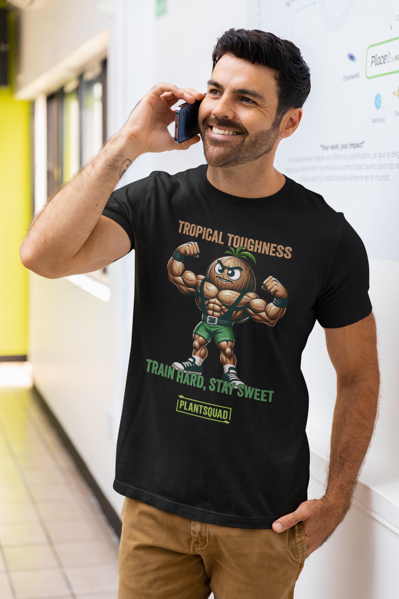 The Plantsquad Coconut "Tropical Toughness Train Hard Stay Sweet" - Unisex T-Shirt showcases a muscular pineapple character flexing in green shorts. Above, bold text declares "Tropical Toughness," while below it encourages "Train Hard, Stay Sweet." The design is complete with "Plantsquad" at the bottom in a vibrant green box.