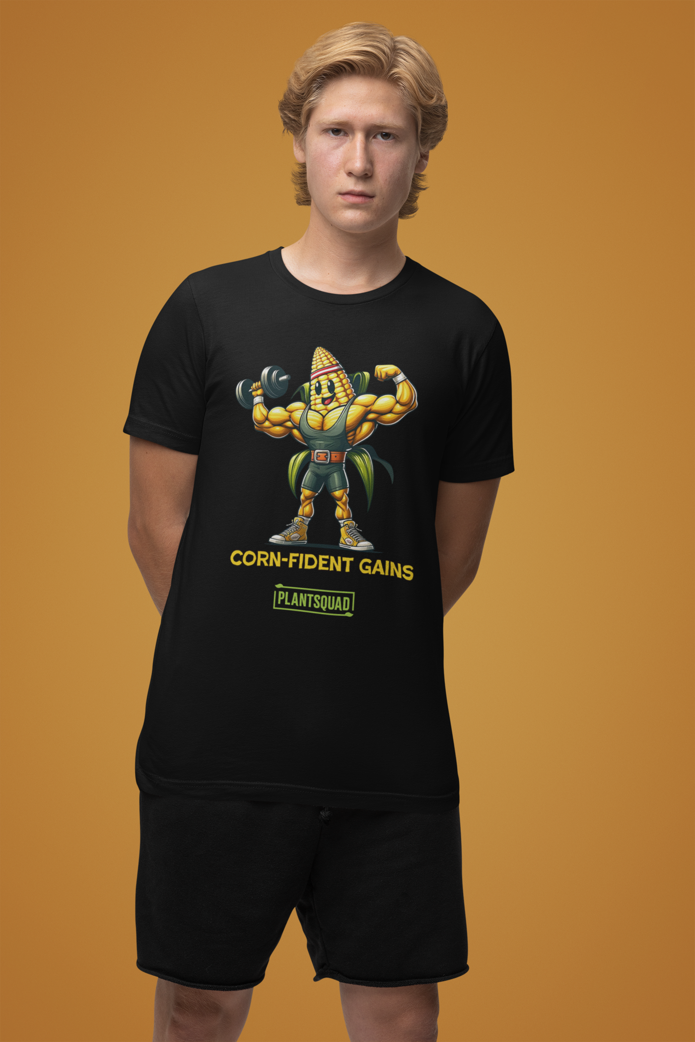 The Plantsquad Corn "Corn-fident Gains" - Unisex T-Shirt showcases a muscular cartoon corn cob sporting a green belt. The text beneath the character reads, "CORN-FIDENT GAINS," with "plantsquad" proudly displayed in a green box below it.