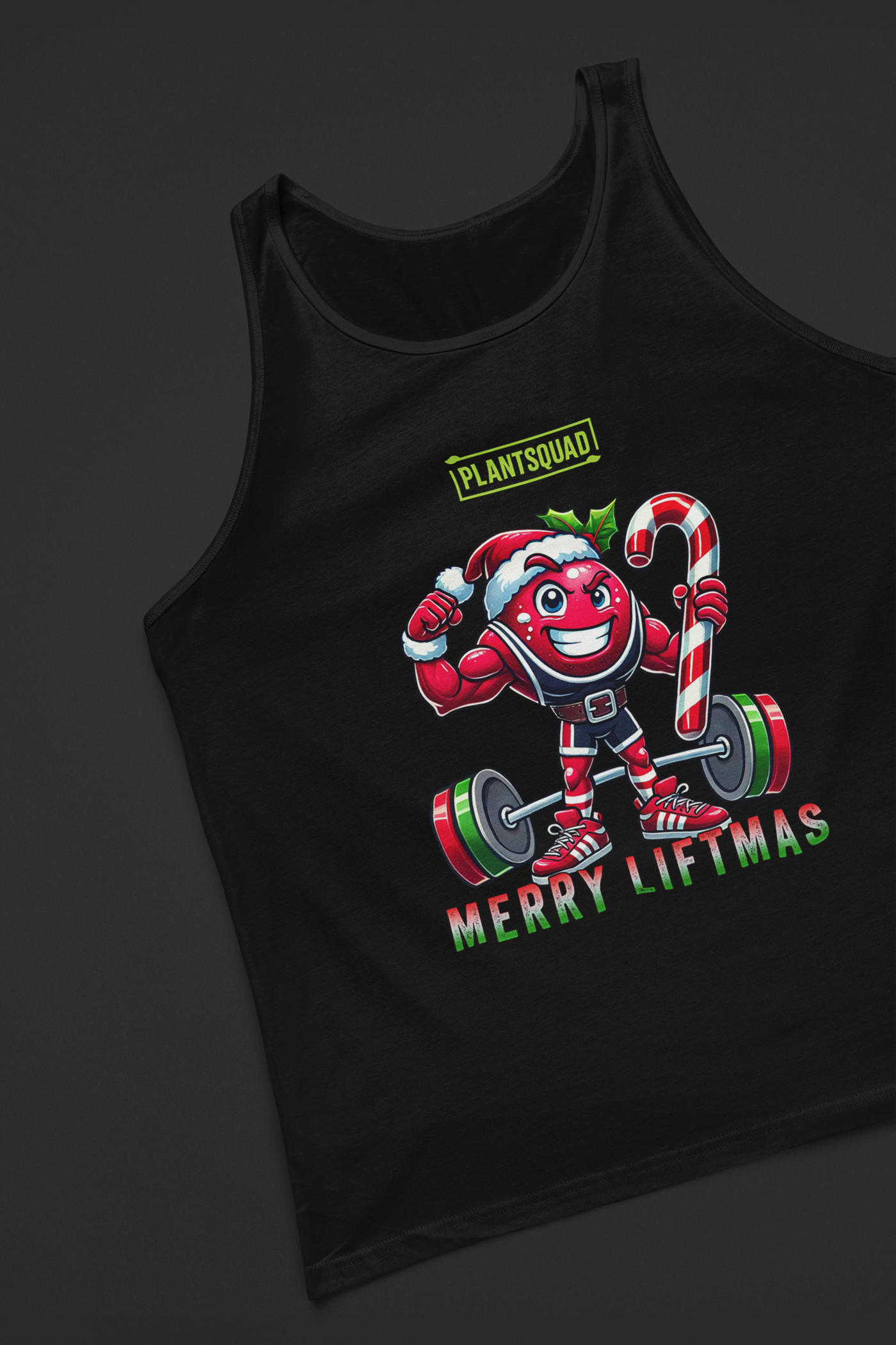 A picture of a tank top featuring a strong looking cranberry cartoon character flexing its arms holding a candy cane.  A small green logo "PLANTSQUAD" appears above the character, "MERRY LIFTMAS" below. Perfect for those embracing a plant-based or vegan lifestyle that are into fitness