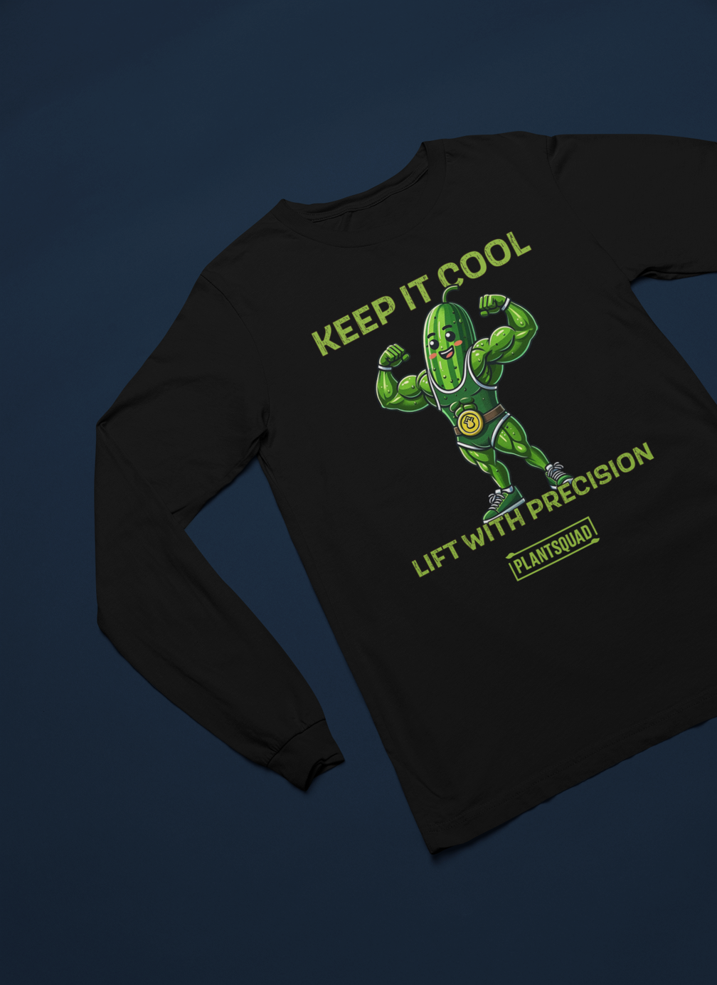 A Plantsquad Cucumber "Keep It Cool Lift With Precision" - Unisex Long Sleeve T-Shirt featuring a cartoon pickle character flexing muscular arms, wearing a green superhero-like costume. Above the pickle, text reads "KEEP IT COOL," and below, it says "LIFT WITH PRECISION." Ideal for those into vegan fitness and proudly part of the "PLANTSQUAD.