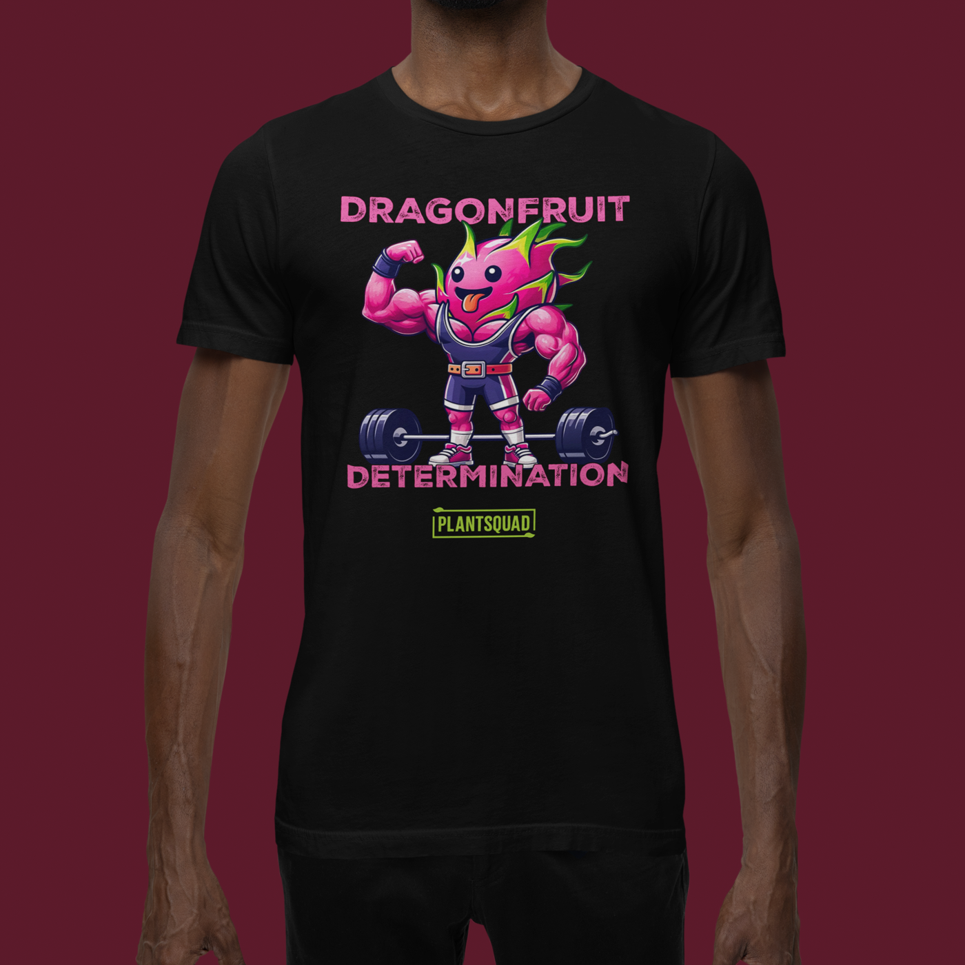 The Plantsquad Dragonfruit "Dragonfruit Determination" - Unisex T-Shirt features a black T-shirt with a muscular anthropomorphic dragon fruit character lifting weights. The text above the character reads "Dragonfruit" and below it reads "Determination." At the bottom, there's a stylish PlantSquad logo.