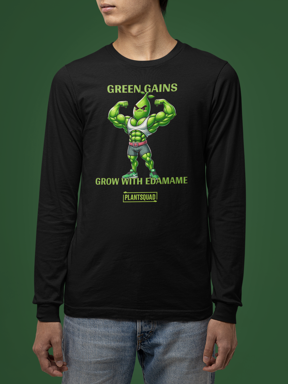 A Plantsquad Edamame "Green Gains Grow With Edamame" - Unisex Long Sleeve T-Shirt featuring a muscly edamame cartoon character flexing its arms. Above the character, the text reads "GREEN GAINS." Below it, the text reads "GROW WITH EDAMAME." Perfect for fitness enthusiasts embracing a vegan lifestyle. The brand logo "PLANTSQUAD" is at the bottom.