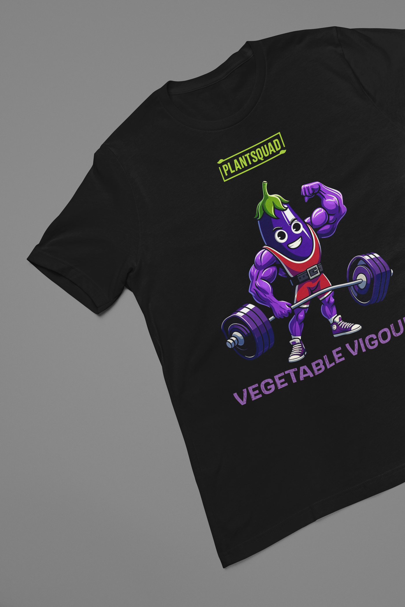 A Plantsquad Eggplant "Vegetable Vigour" - Unisex T-Shirt featuring a cartoon eggplant character lifting a heavy barbell. The muscular, smiling eggplant sports red shorts and green hair. Above the character, it proudly reads "PLANTSQUAD," with "VEGETABLE VIGOUR" in bold purple letters below.