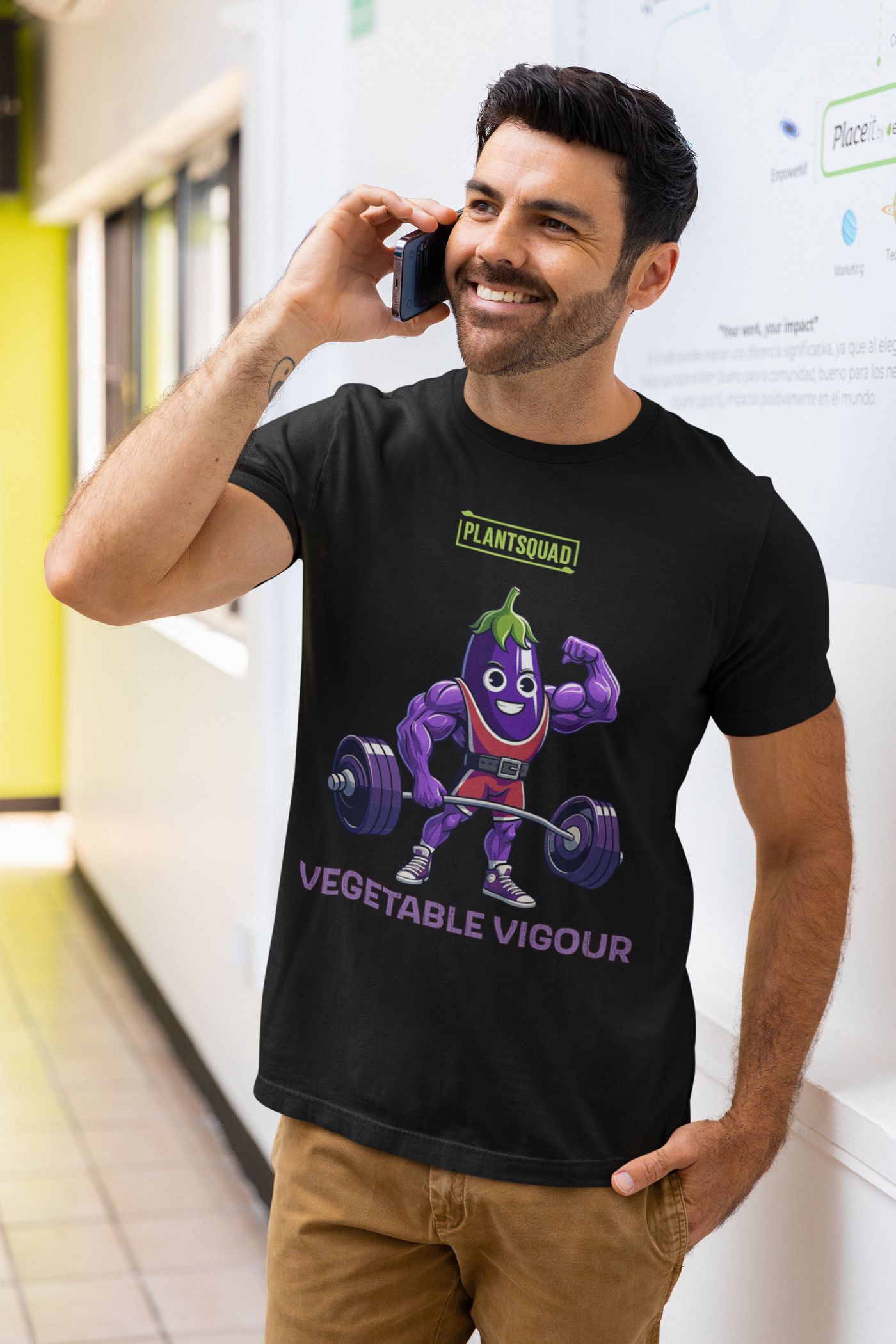 A Plantsquad Eggplant "Vegetable Vigour" - Unisex T-Shirt featuring a cartoon eggplant character lifting a heavy barbell. The muscular, smiling eggplant sports red shorts and green hair. Above the character, it proudly reads "PLANTSQUAD," with "VEGETABLE VIGOUR" in bold purple letters below.