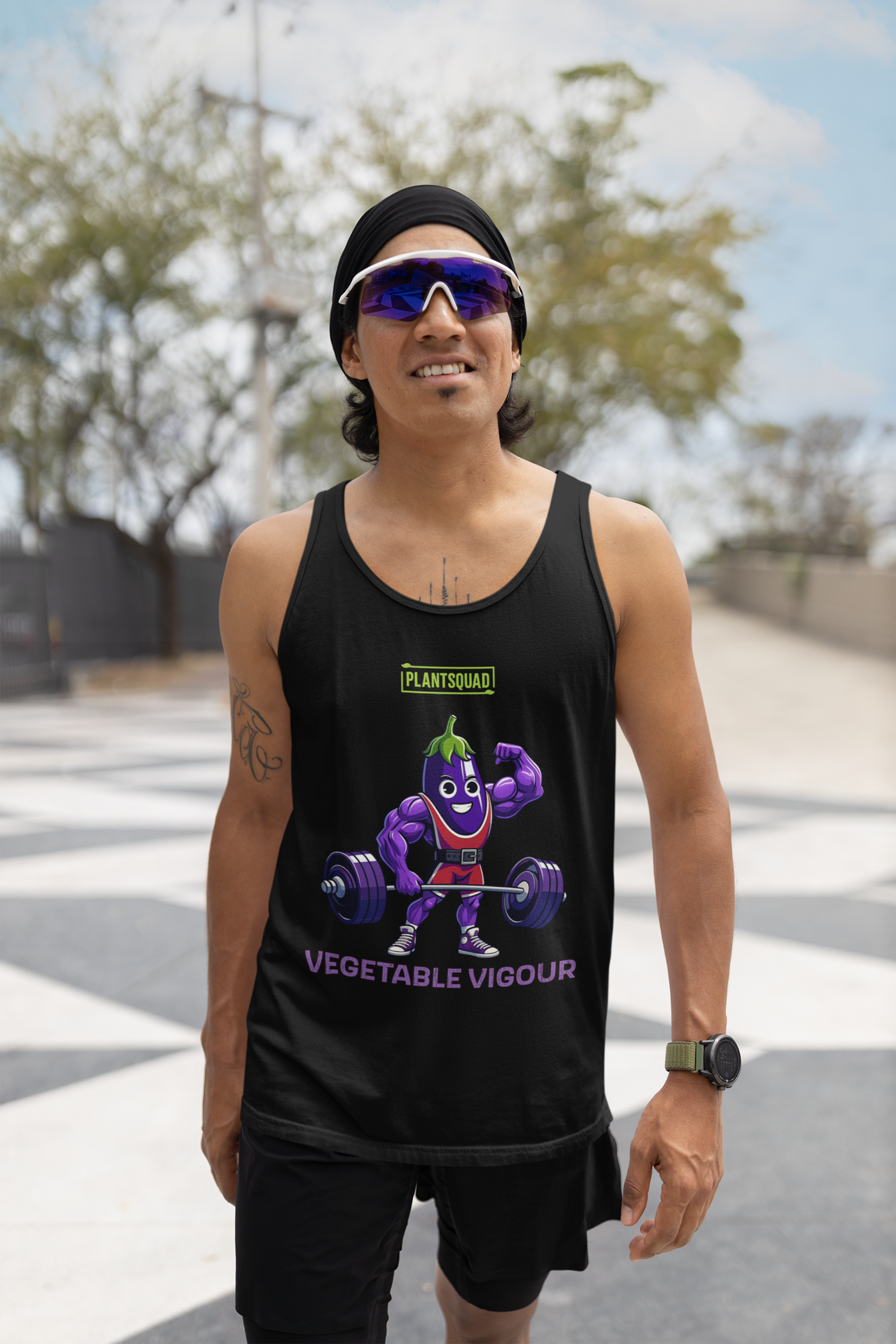 Black vegan tank top featuring a muscular, purple cartoon eggplant character lifting heavy barbells. The eggplant is smiling and flexing one arm. Perfect for gym enthusiasts with a plant-based lifestyle, this top has "PLANT SQUAD" above the character and "VEGETABLE VIGOUR" below in bold text. Introducing the Plantsquad Eggplant "Vegetable Vigour" - Unisex Tank Top.